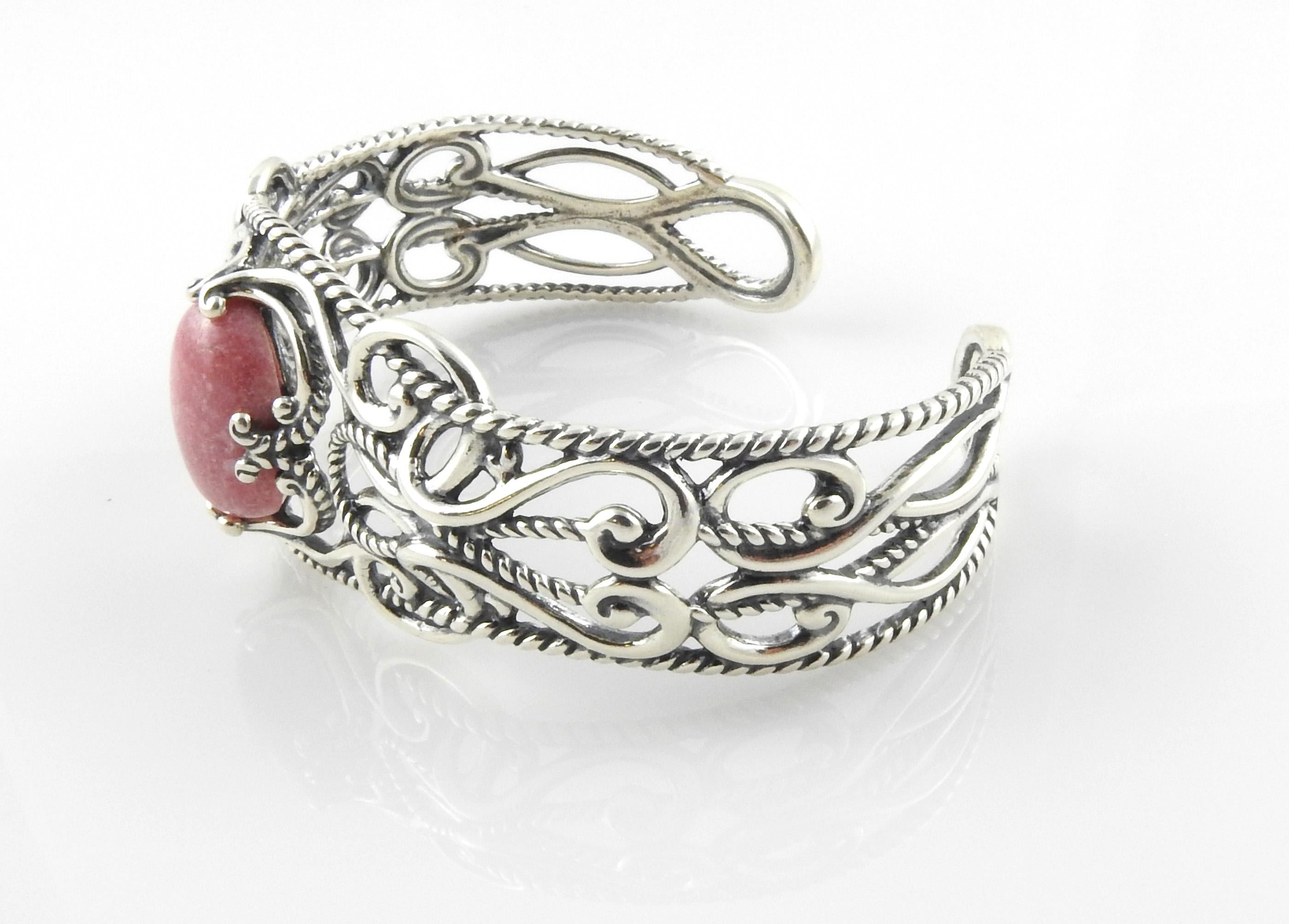 Carolyn Pollack Sterling Silver Rhodonite Cuff Bracelet

 This is a beautiful Sterling Silver Ornate Wide Open-Work Swirl Cuff Bracelet with Pink Rhodonite Gemstone

Weight:       39.7 g  /  25.5 dwt

Condition:  In good condition with some minor