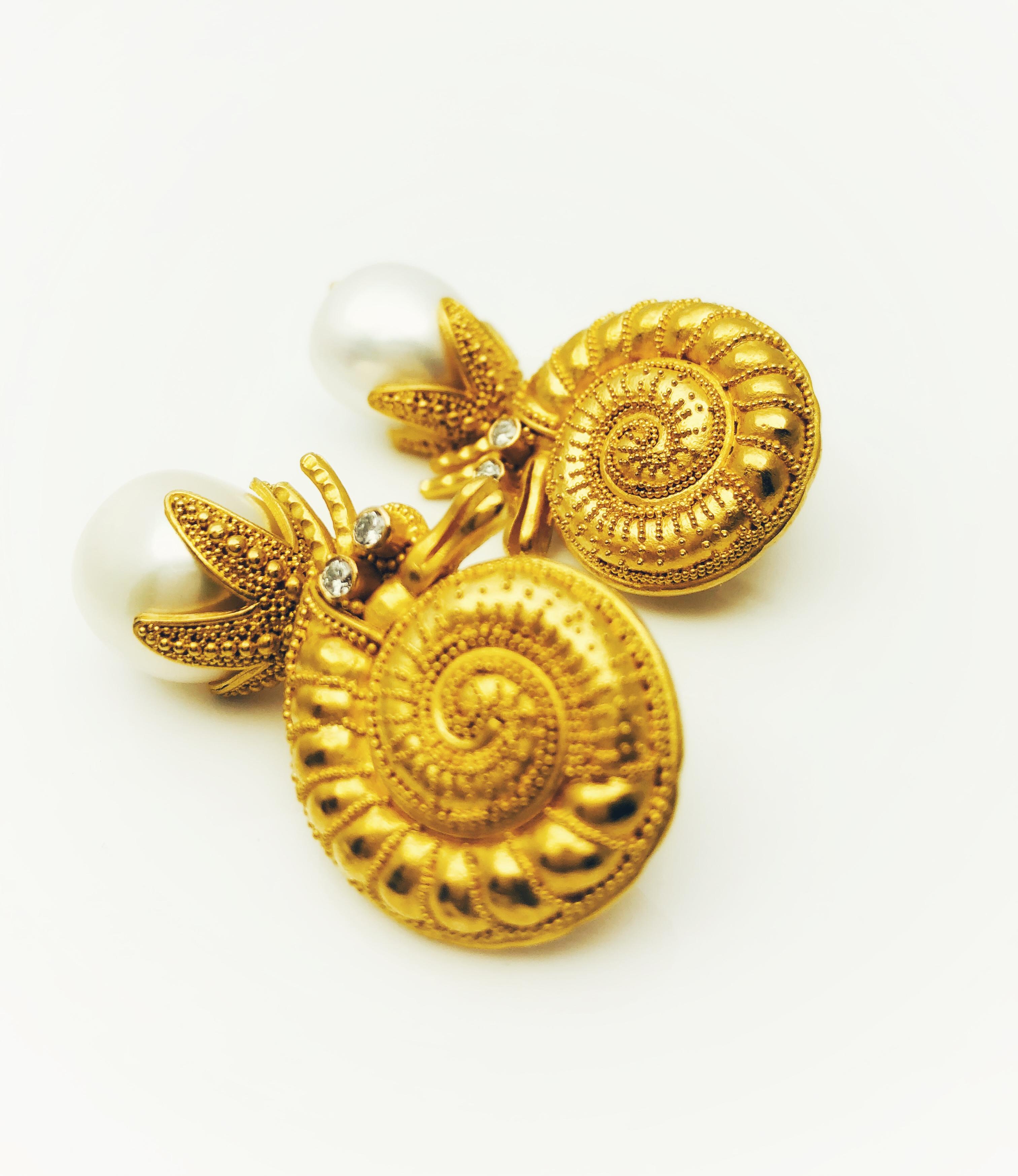 This is an absolutely stunning and so unique pair of earrings! These are by designer Carolyn Tyler. So many details on this set! The craftsmanship and detail is remarkable! These hermit crabs are made in 22 k yellow gold. They have 2 round brilliant