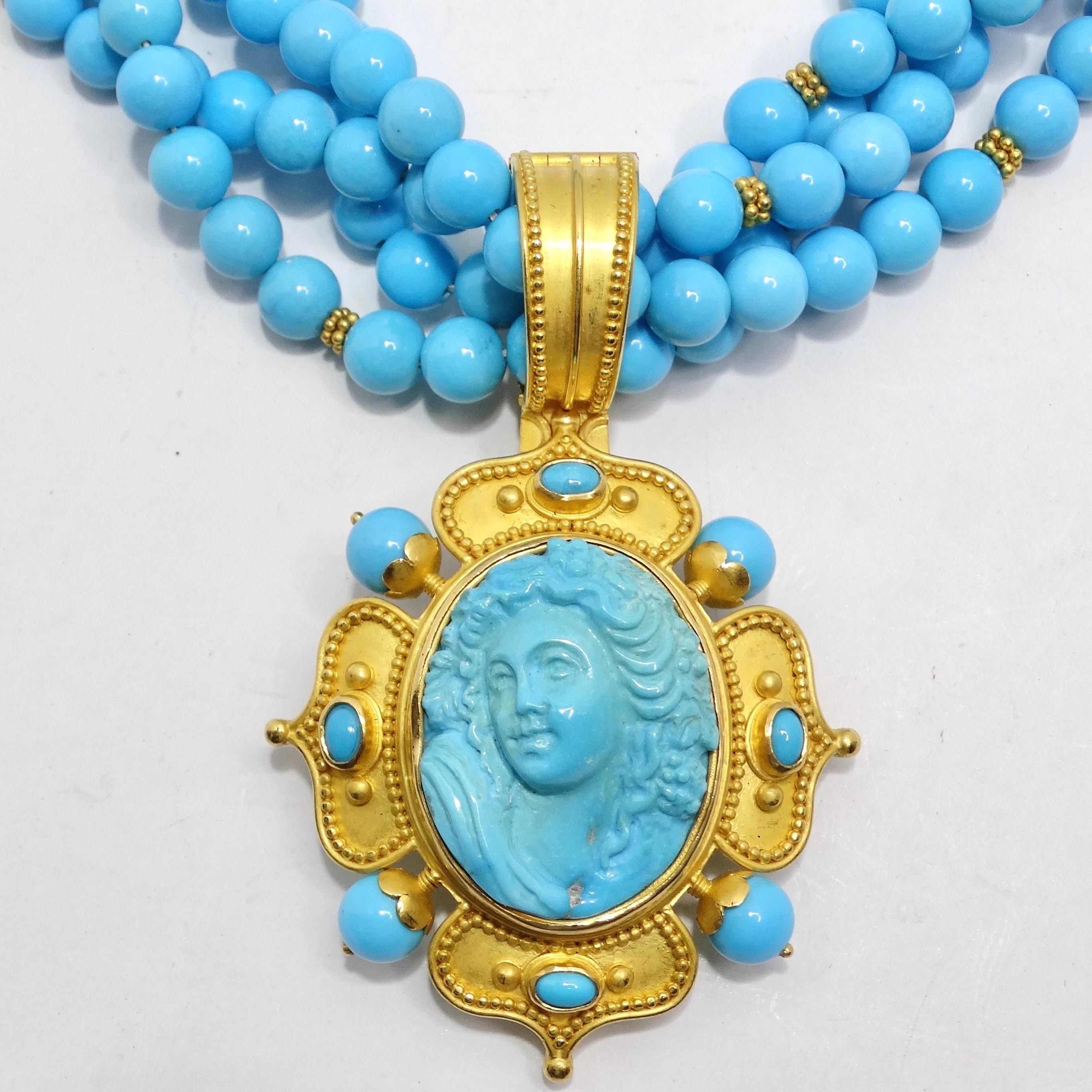 Introducing the Carolyn Tyler 22K Gold Sleeping Beauty Turquoise Cameo Pendant Necklace, a luxurious and captivating piece of jewelry that's bound to become the centerpiece of your collection. Crafted with multi strands of Sleeping Beauty turquoise