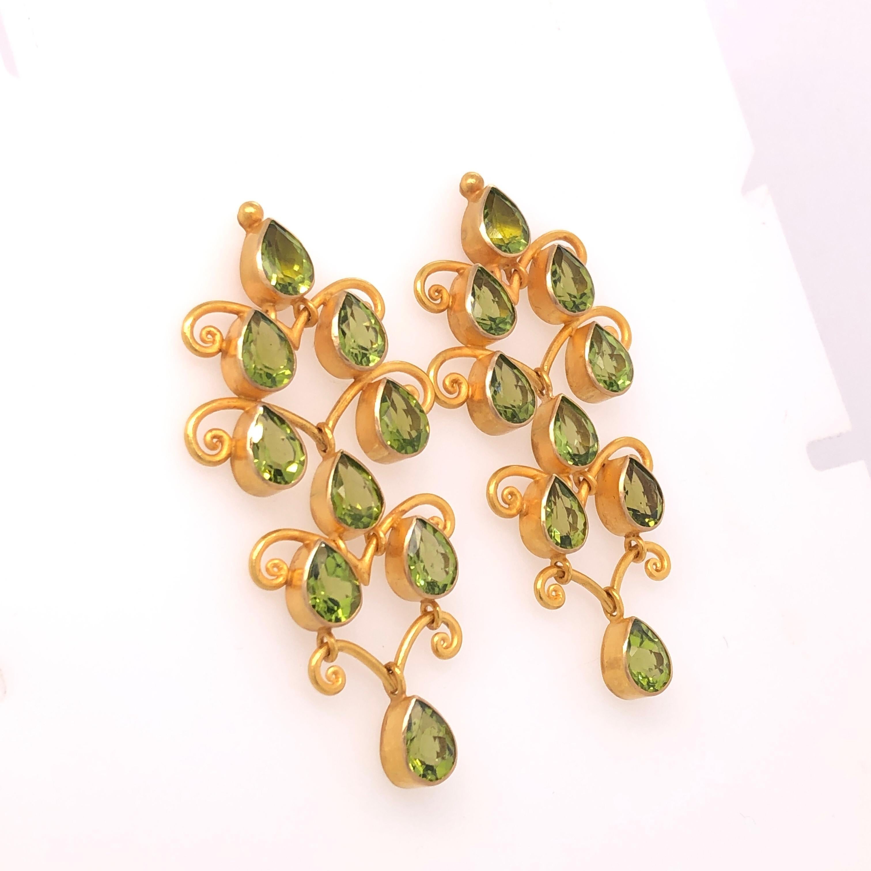 Elegantly designed Carolyn Tyler's Baghdad pear shaped peridot earrings are a wonderful compliment to dress up your favorite jeans or dress. 

13.32 CTW Peridot 

Stamped: 18K