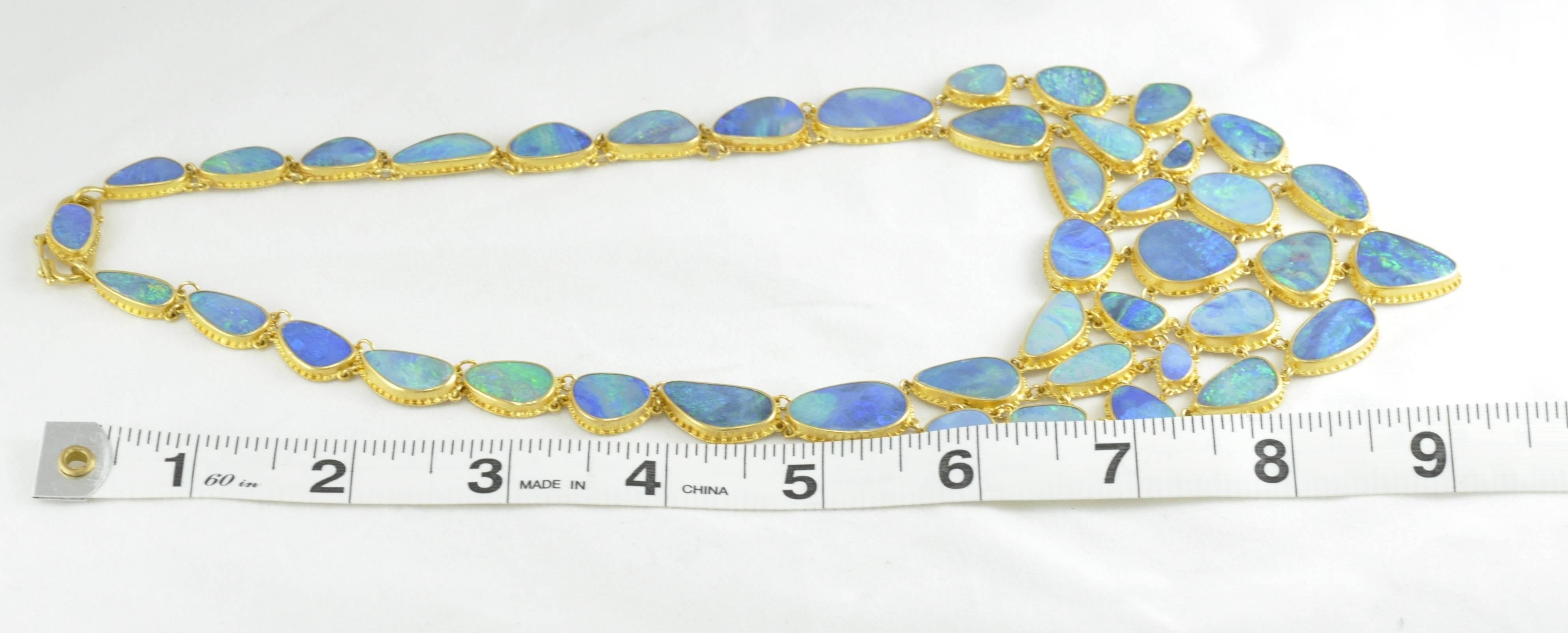 Carolyn Tyler Fishnet Boulder Opal and Gold Necklace. 
22k Gold with 140ct of Black Opal and Natural Ironstone Doublet 
This necklace hangs 17 inches 