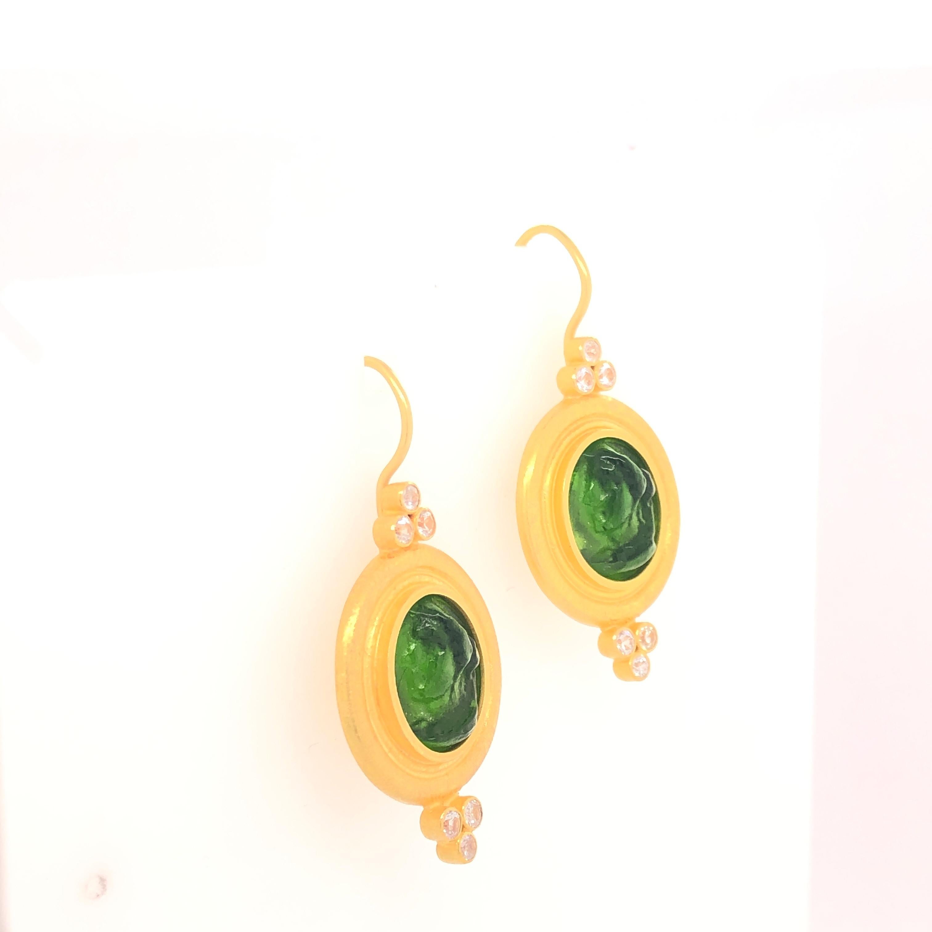 Beautifully carved green Venetian glass is framed in oval drops with White Sapphires. These are perfect for casual and formal occasions. 

Stamped: 22K, C. Tyler, Indonesia