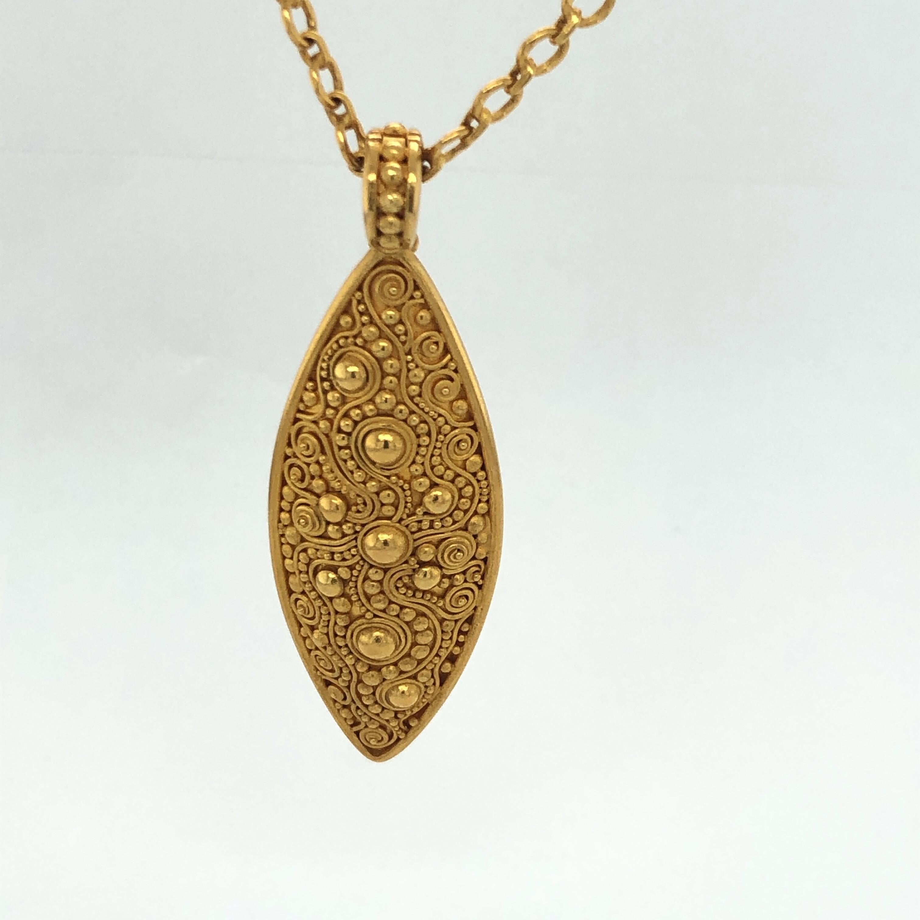 Carolyn Tyler 18 and 22K Yellow Gold Neptune Pendant weighs 12 grams and chain weighs 16 grams.  Stamped C Tyler, Indonesia and 22K.  Detachable bezel and detailed granulation work.   Shown here on a beautiful gold circle link 23.5 inch chain with a