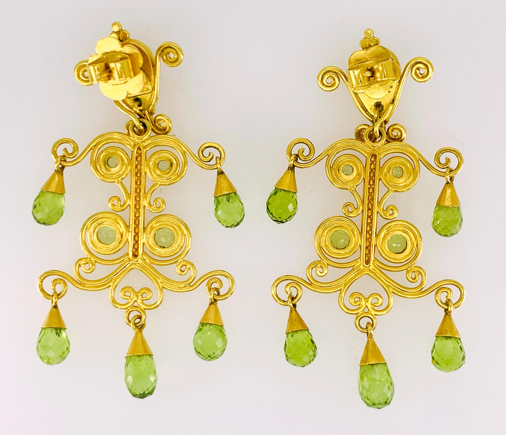 Peridot 'Sonya' Earrings in 22k and 18k Yellow Gold; Designed by Carolyn Tyler.  Featuring 20.08 carats of faceted Briolette, Pear Shape and Round cut Peridots with hand formed gold details.  The chandelier portion of the earring may also be removed