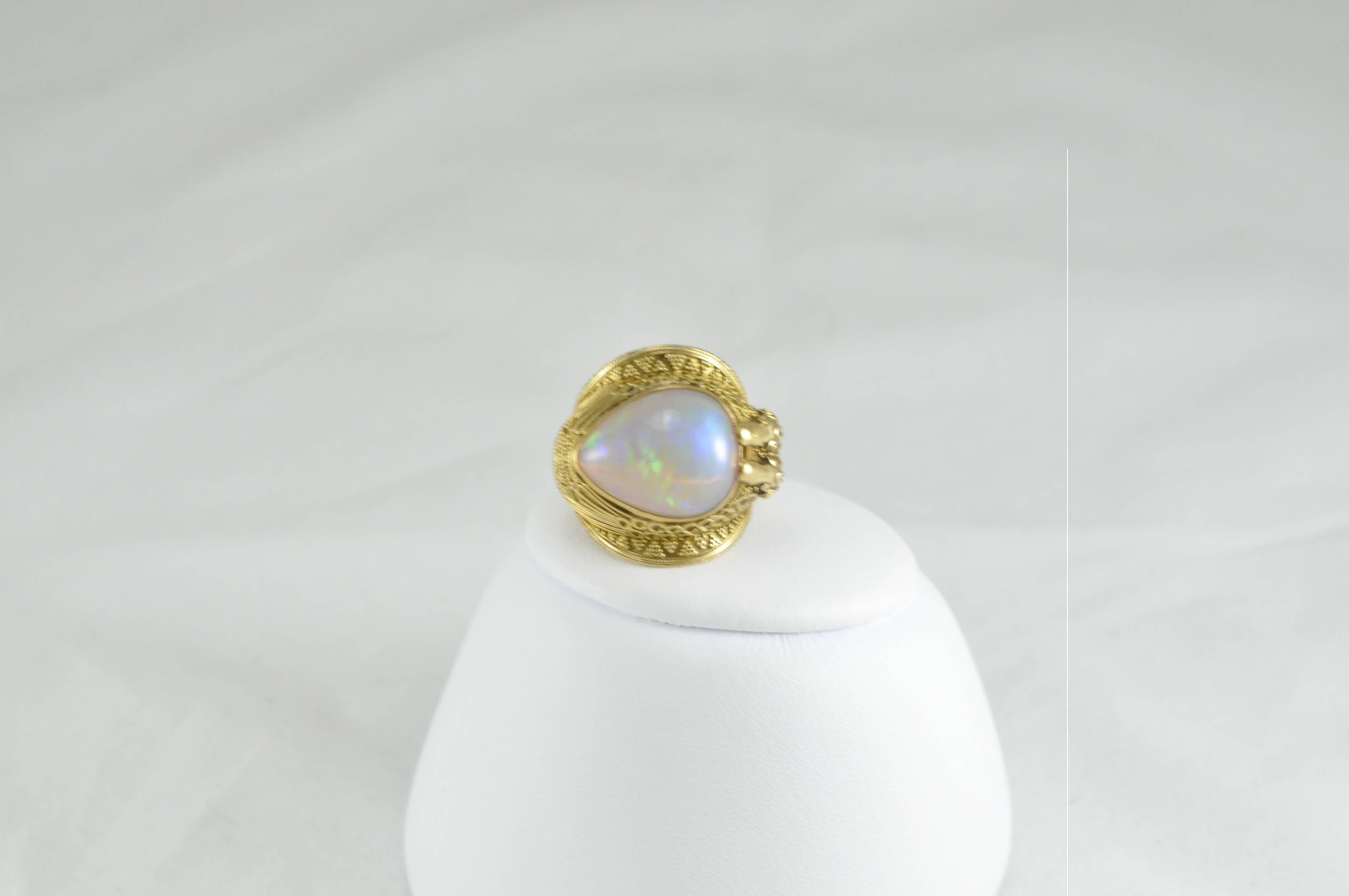 Signature Carolyn Tyler Ring with 22k Gold, and 9ct Ethiopian Opal.  Size 7.5.  The ring is stamped C Tyler, INDONESIA, 22K.