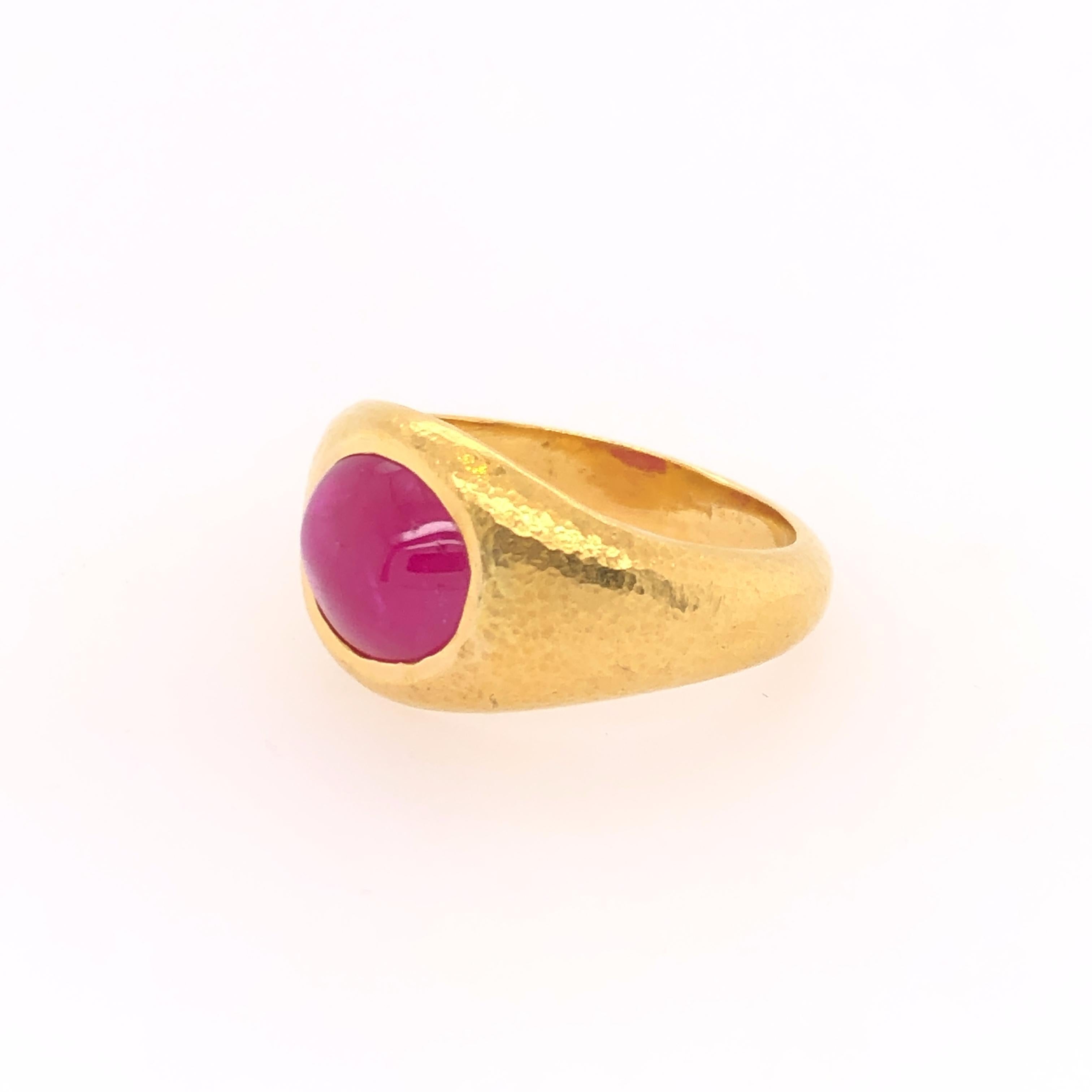 The androgynous aesthetic quality of this ring makes the pure color of the 4.11 CT oval cabochon ruby even more impressive. Crafted in 22K yellow gold this ring can compliment a plethora of styles. 

Size: 9.5

Stamped: 22K, C. Tyler, Indonesia