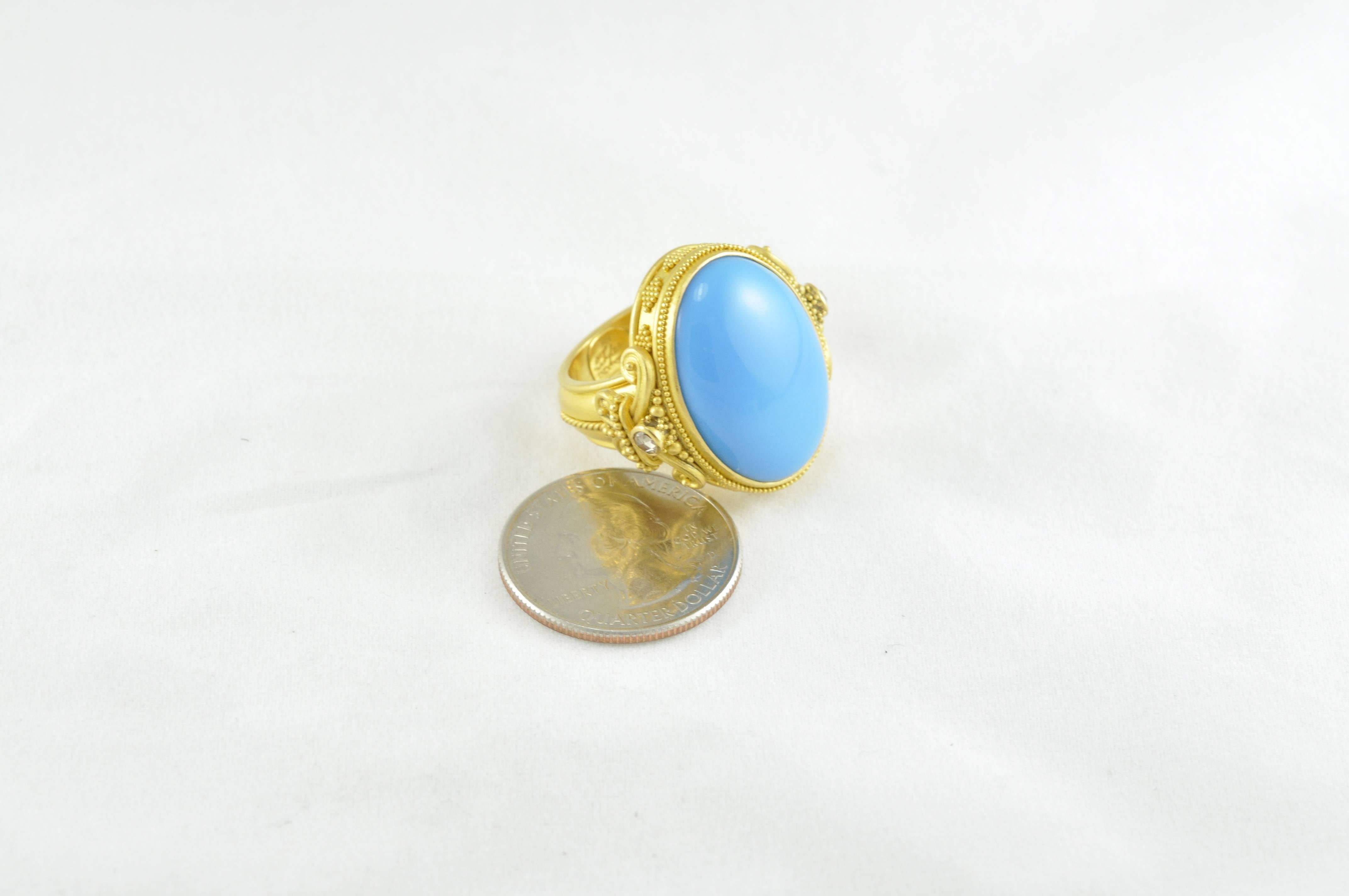 Fleur De Lys Carolyn Tyler Ring featuring an Extra Fine 20.5ctw Beautiful Cabochon Turquoise Stone from the Sleeping Beauty Mine With Diamonds. 
22K gold and granulation.   
Current Size is 7.5