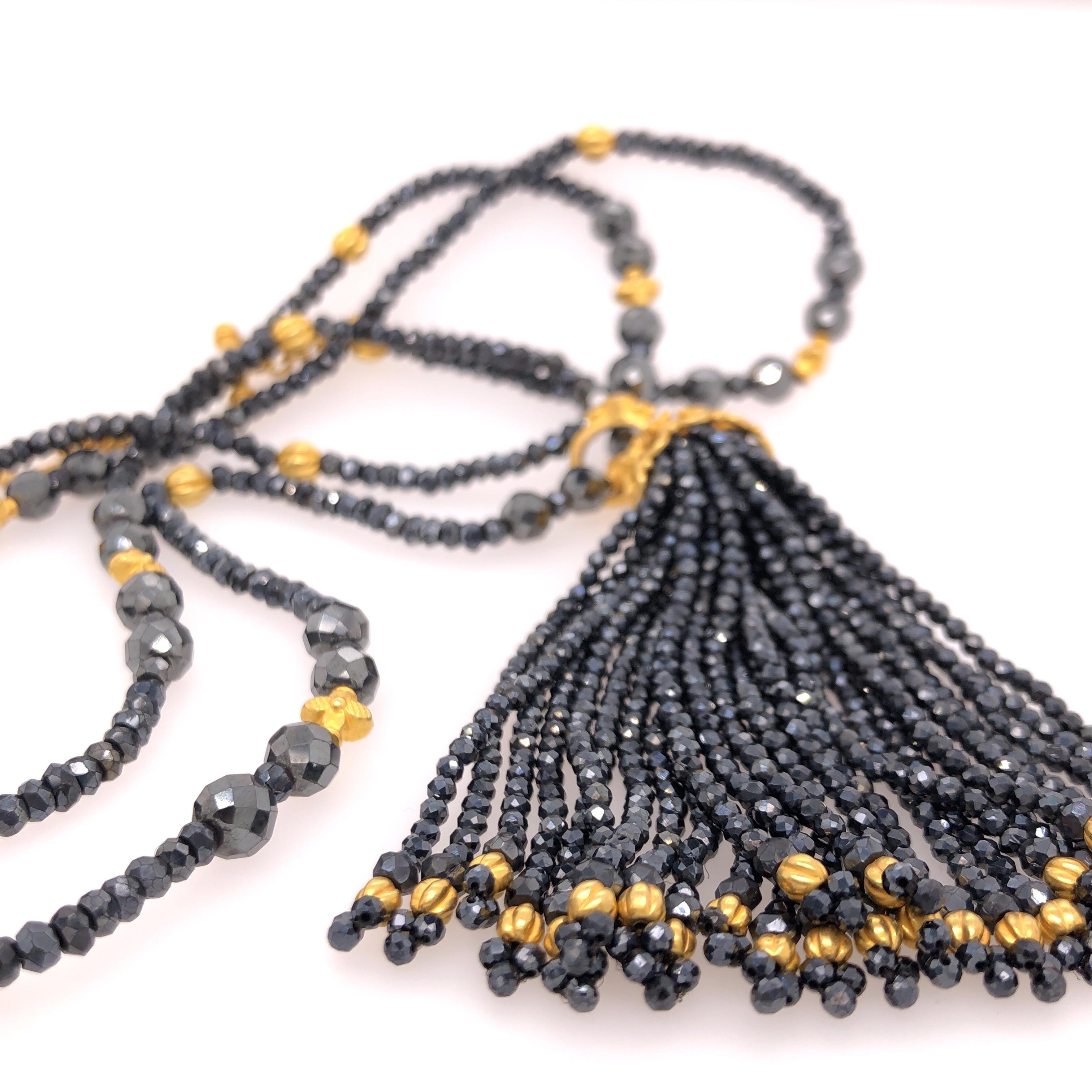121.5 CTW Spinel Lola Necklace 
18K YG 
Loop Tassel consists of 89 carats of black spinel faceted beads with a 22k gold handmade cap and black diamond-set detachable clip.

Stamped: 18K, C. Tyler, Indonesia