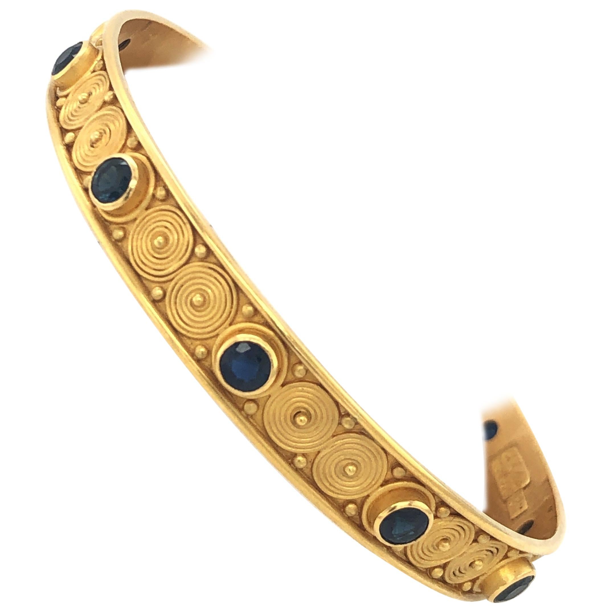 Carolyn Tyler Yellow Gold and Blue Sapphire Spiral Bangle