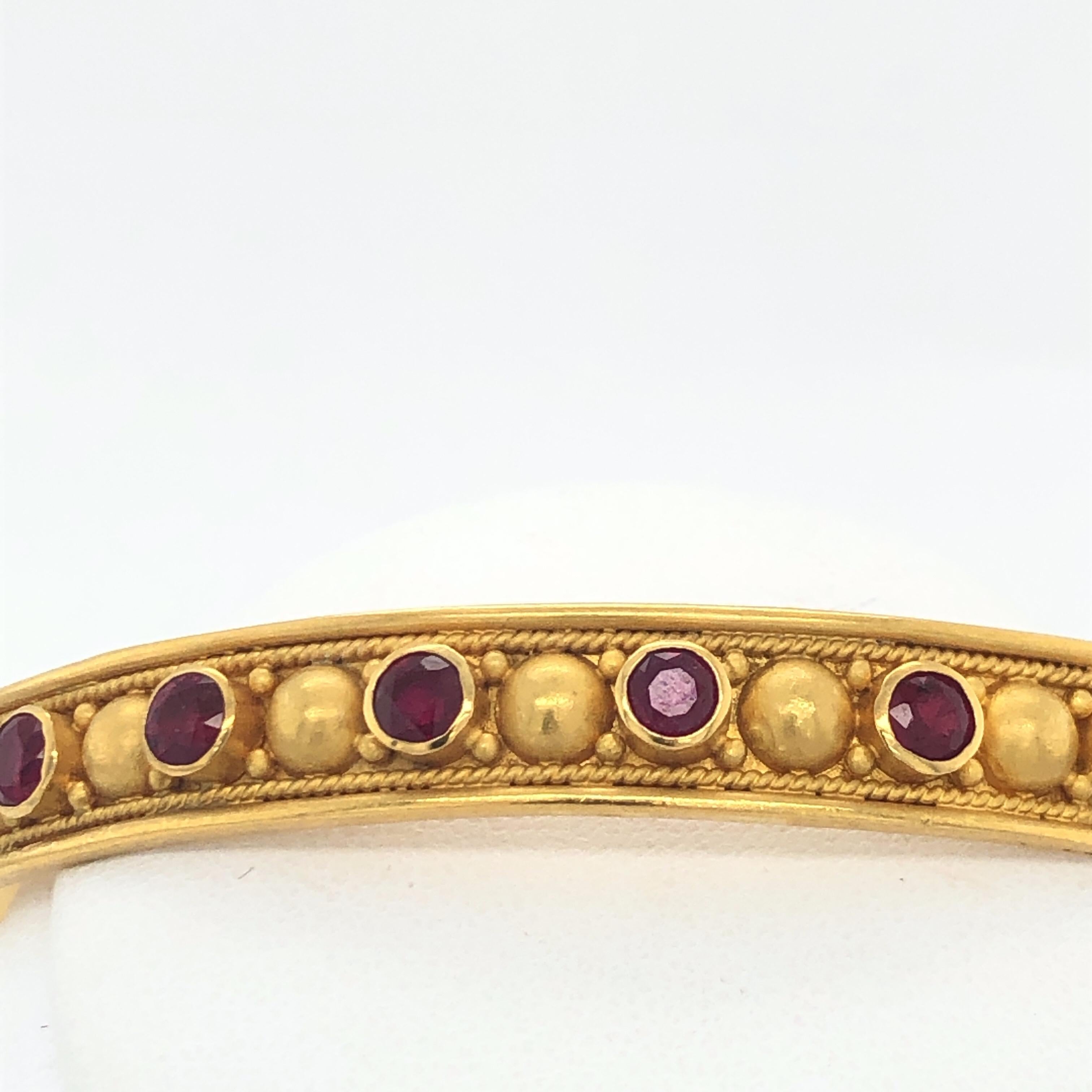 Gorgeous Carolyn Tyler 18 and 22K Gold Bangle Bracelet with Rubies. 5.9CT Rubies.   Signature Carolyn Tyler Style with gorgeous and has the exquisite detailed work including the 22K granulation.  8 inches. Stamped C Tyler, Indonesia, 18K  22K . 