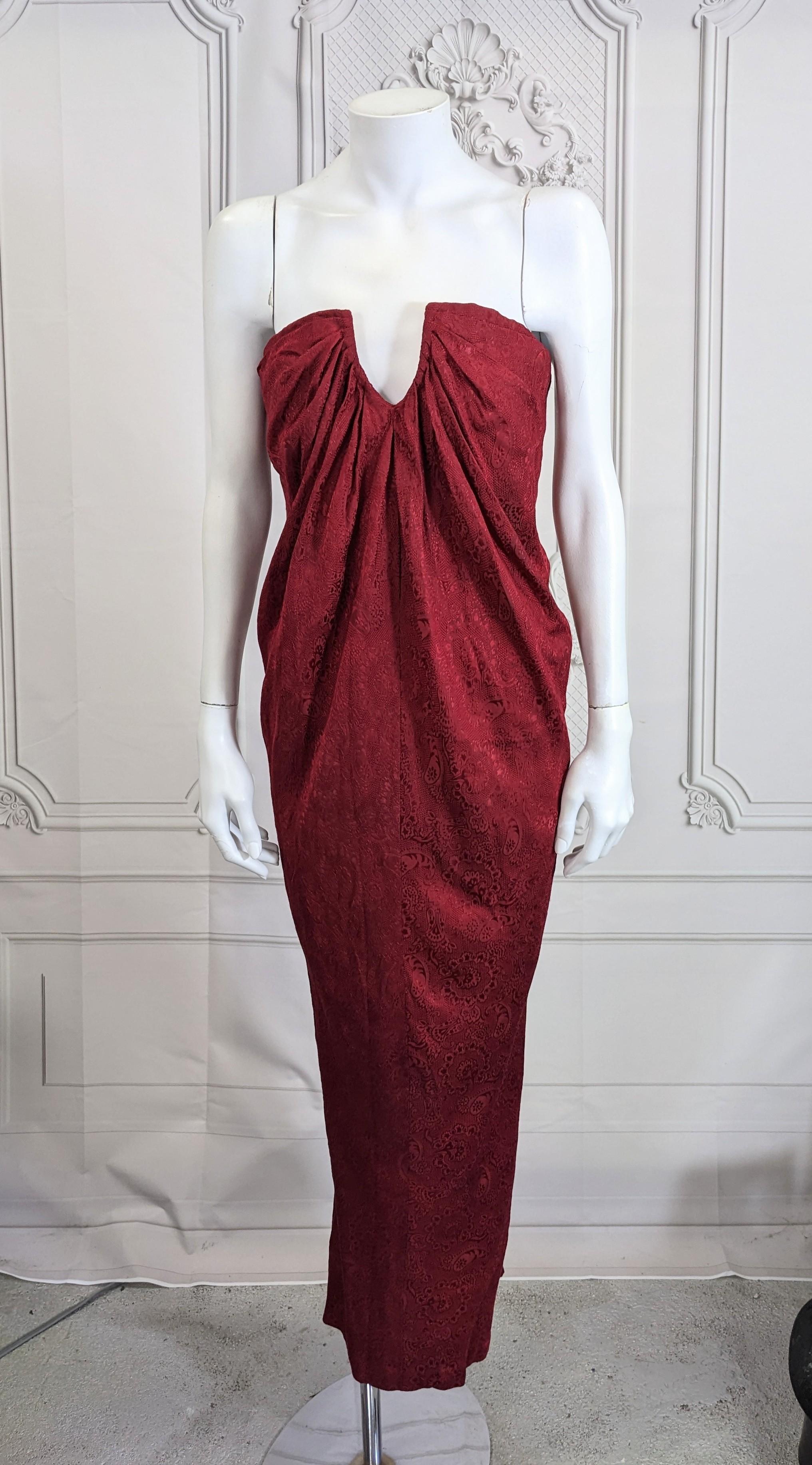 Elegant Carolyne Roehm Strapless Burgundy Organza Gown with gathered bodice line which drapes into a pegged shape at hem. 
Patterned washed silk organza is used for this deceptively simple but elegant gown. Back zip entry. Size 4, 1990's USA. 