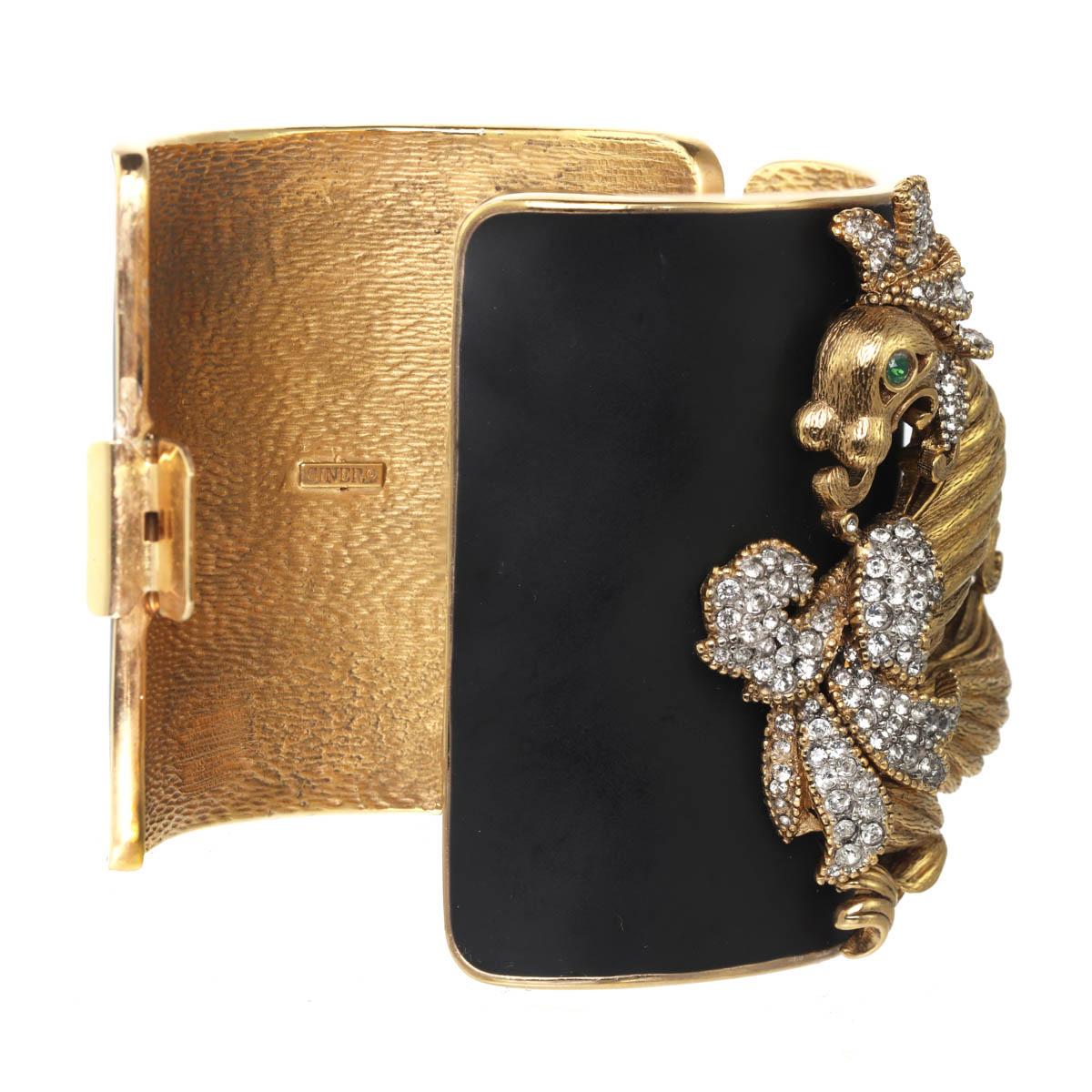 Tall and regal, this cuff  features CINER's original midcentury Chinoiserie influenced dragon on a matte black enamel base. An incredibly designed piece, this fluted dragon has brushed and high polished details, creating a conversational piece you