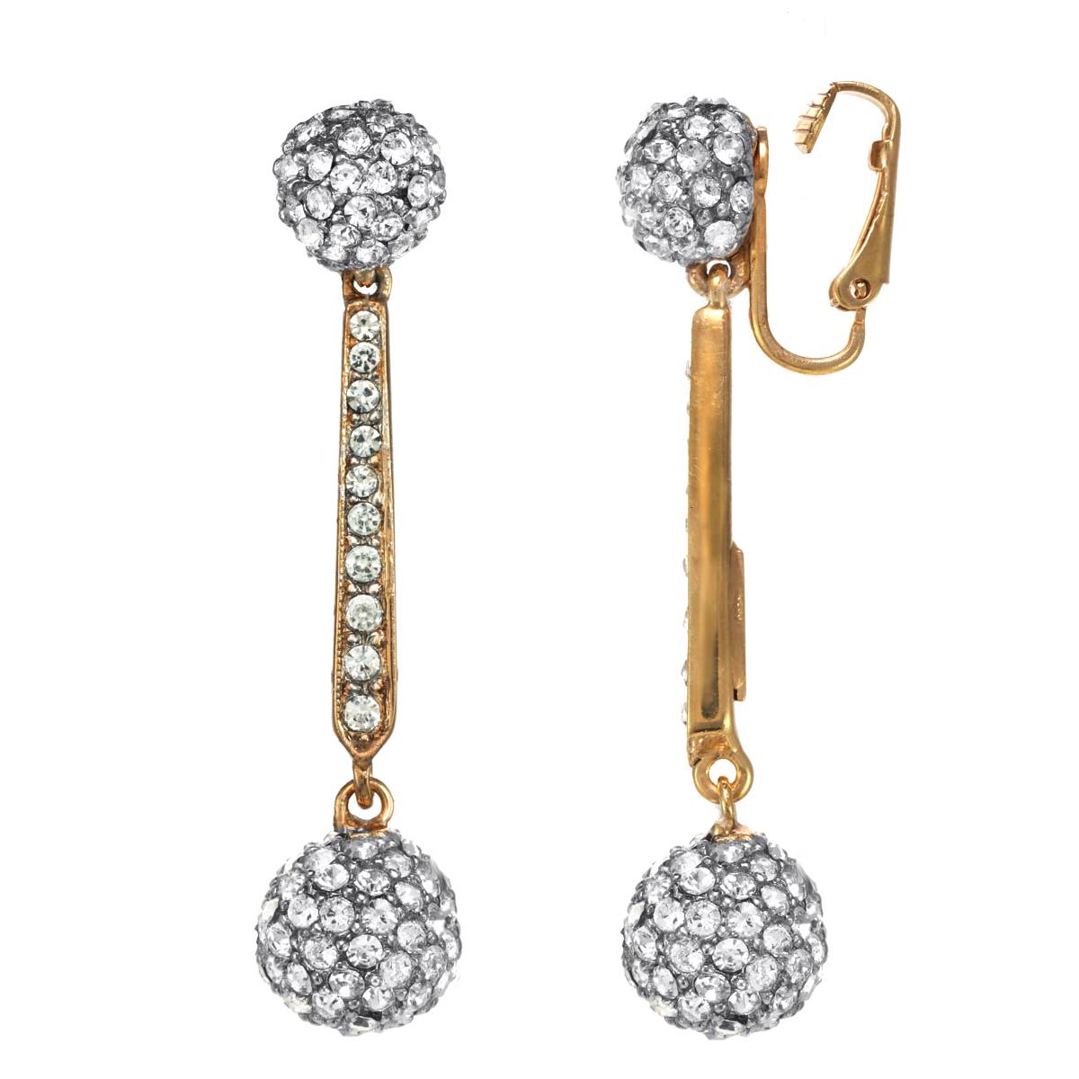 A classic design, these Crystal Ball Drop Earrings are adorned with illuminating Swarovski crystal rhinestones. Available in clip or post, these earrings are the perfect accessory to bring you from day to night. 

**Please advise  what backing you