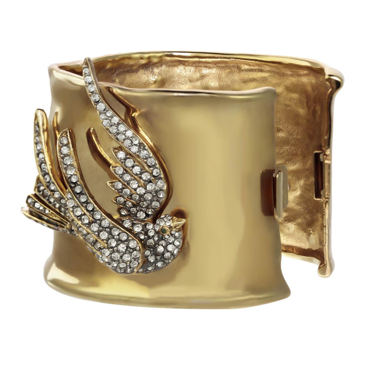 An organic gold cuff meets a forever-graceful Swarovski  rhinestone encrusted dove on this gorgeous piece. From Carolyne's collaboration with heritage jewelry design house, CINER, the marriage of these two pieces, and designers, could not be more