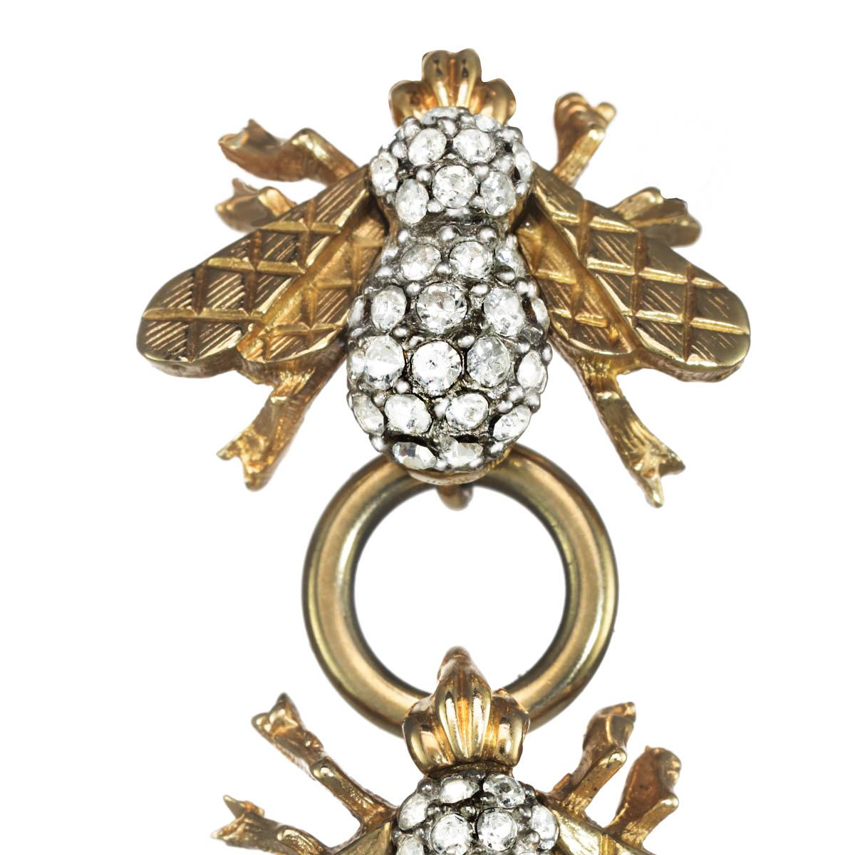 Three CINER heritage bees, with polished gold connectors, encompasses this gorgeous linear statement earring. With beautifully detailed gold quilted wings and illuminating Swarovski crystal rhinestone accents, these earrings are Carolyne's take on