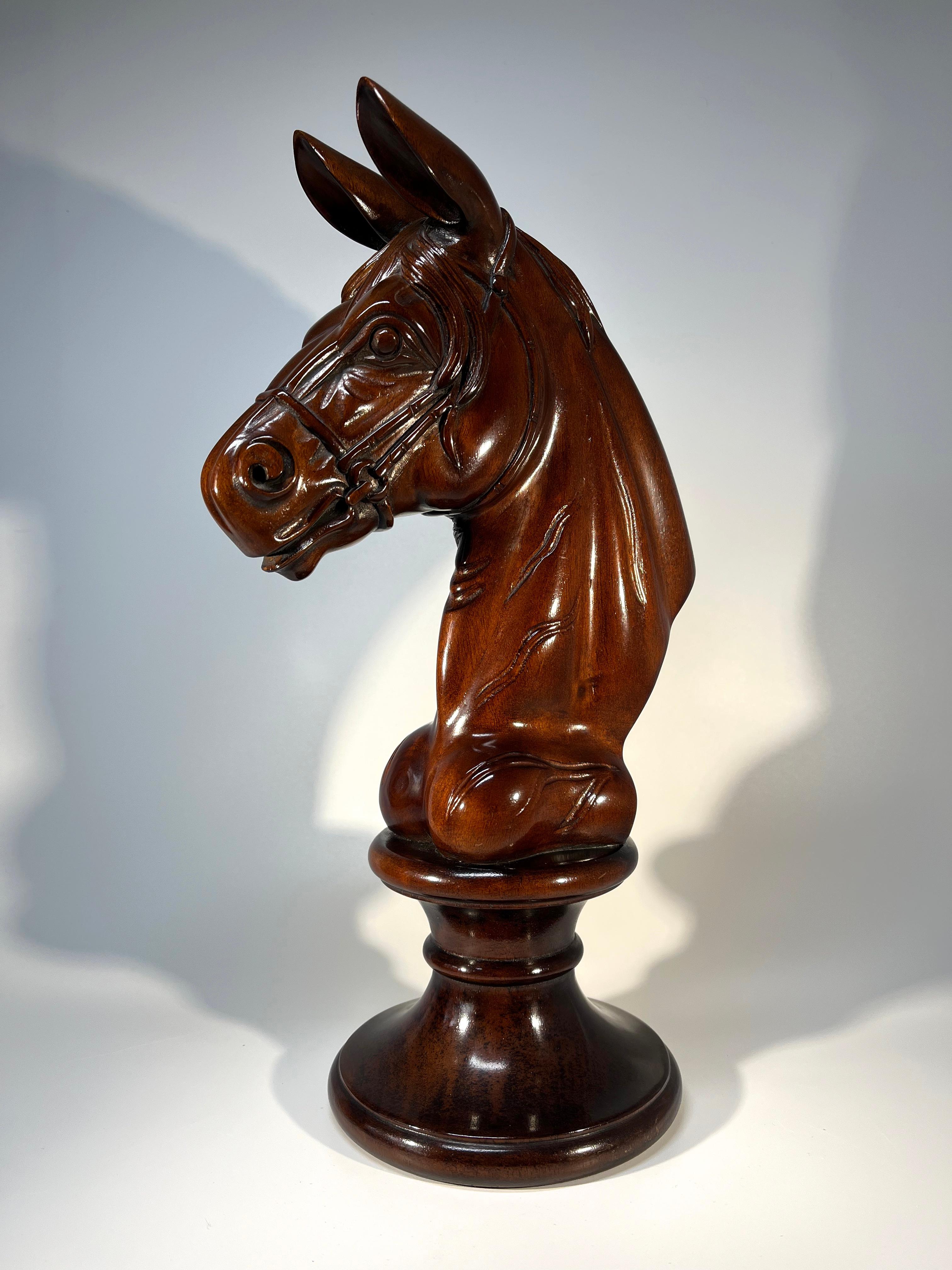 Kindred to a carousel galloper, a distinguished and elegant mahogany Italian horses head on pedestal
Collectible piece of object d'art for the equine devotee
Circa 1960's
Height 14 inch, Width 8 inch, Depth 5.5 inch
In very good condition.  
Wear