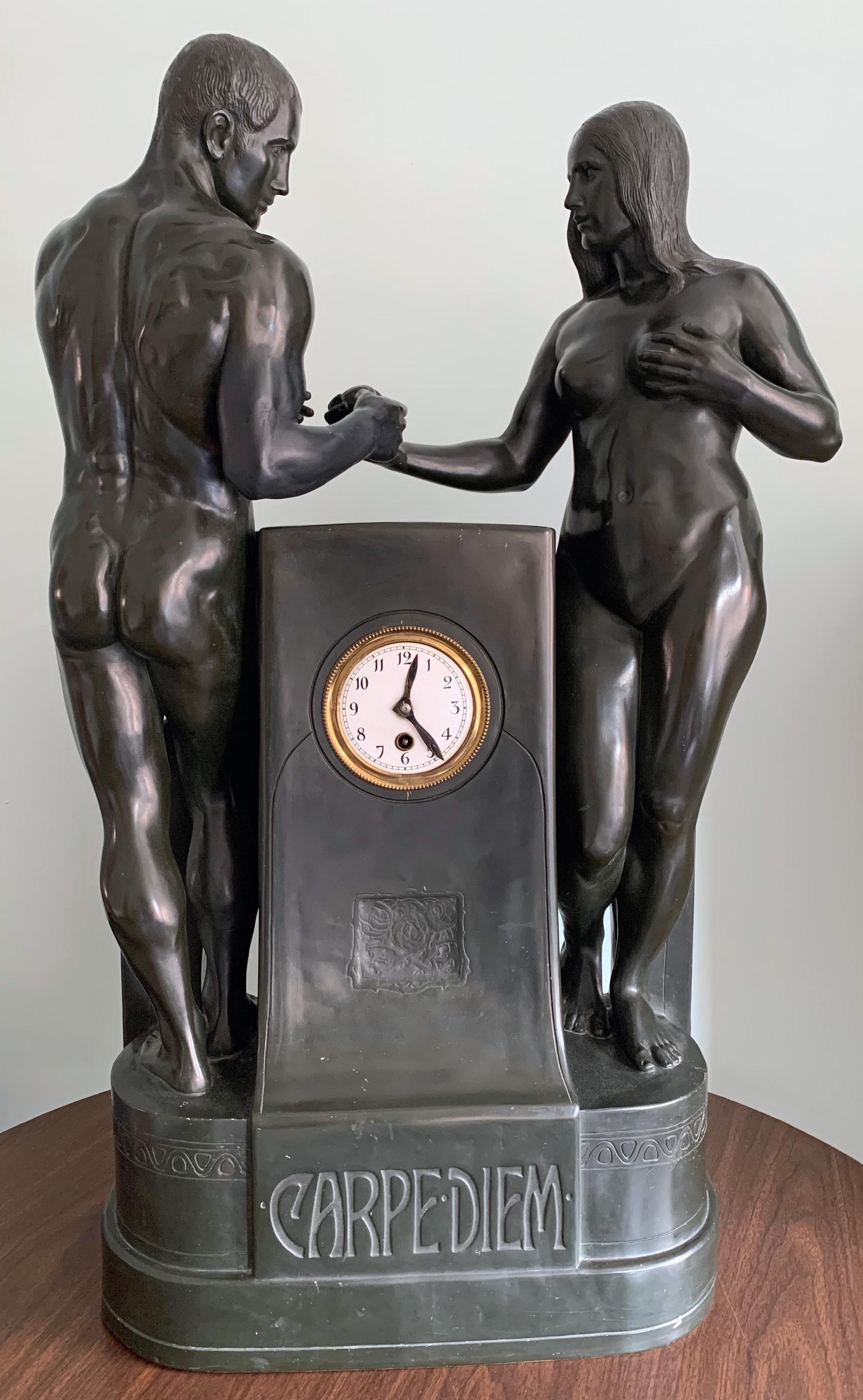 Extremely rare and beautifully sculpted and executed, this monumental terracotta clock depicting a nude Adam and Eve exchanging the fateful apple, is finished in a green-black glaze approximating the dark bronze patina preferred by Germans at the