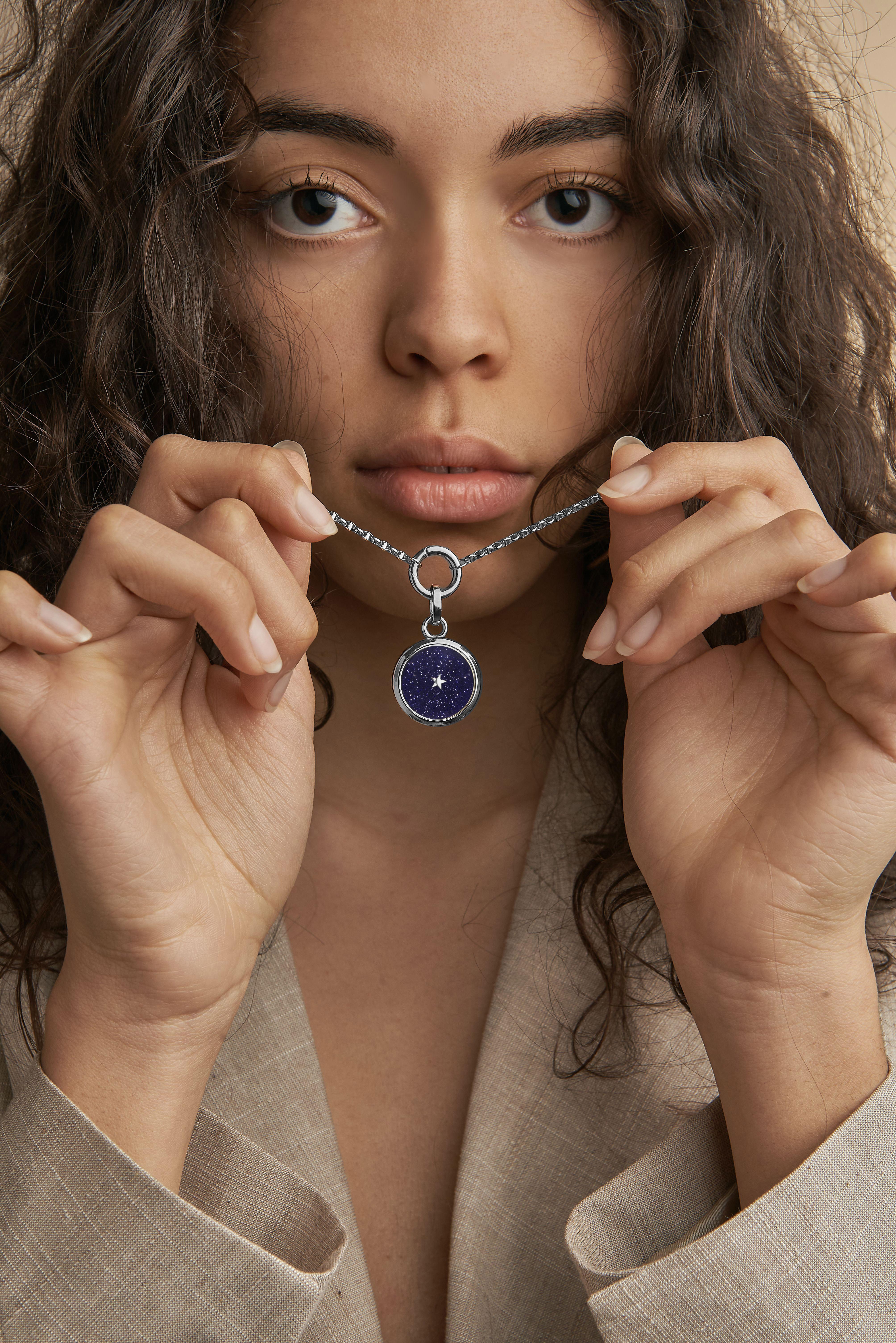 Carpe Diem! Time is now! Titanium Pendant  & 18kt White Gold Clasps , Blue Aventurine dial and a moving star. This is not a watch. It is a poetic pendant , with a quartz movement that allows the little star in the middle to move every second to