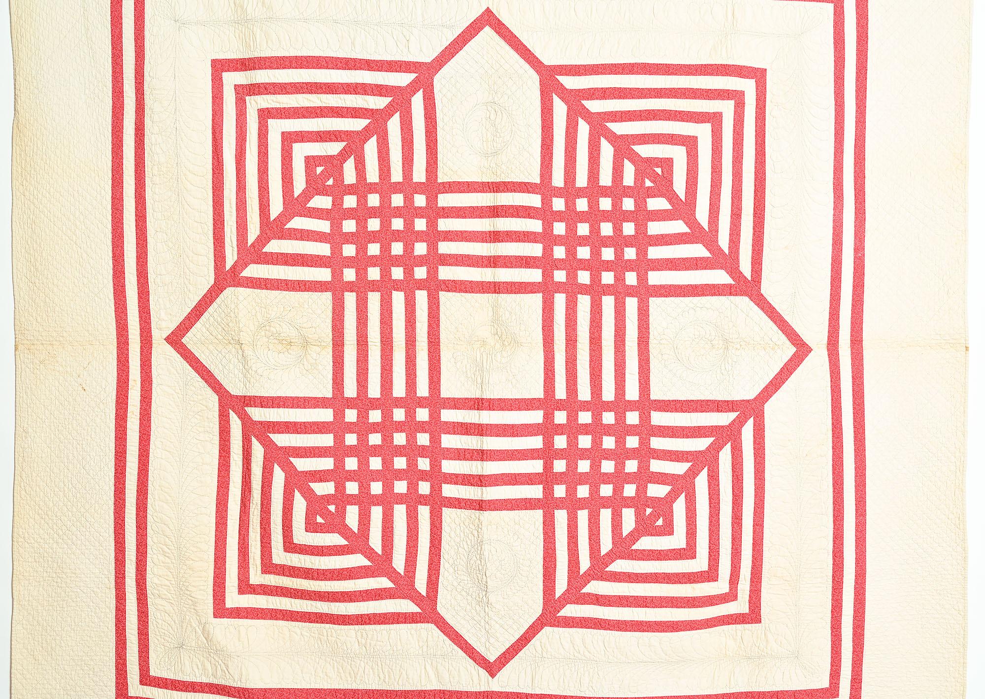 Very rarely does one see a single Carpenter's Square . More often, there are four or five blocks on a quilt. This unusual example has especially fine quilting with a wreath in each of the five corners of the central diamond. The inner border is