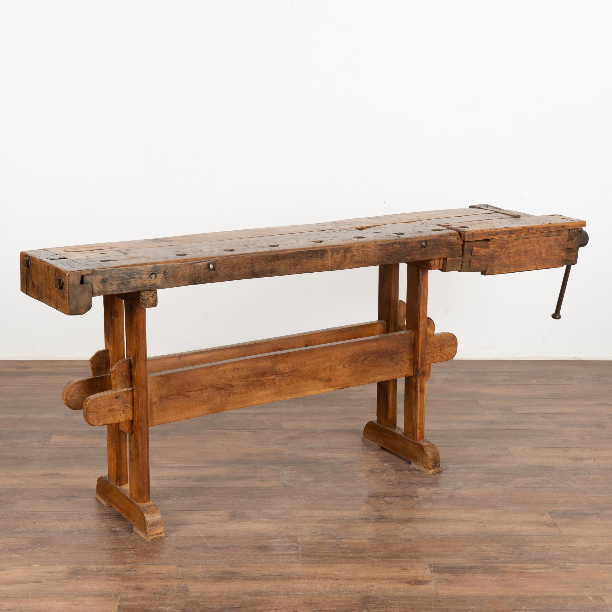 It is the years of constant use revealed in every ding and scratch that enrich the character of this carpenters' workbench from Denmark.
Please examine the close up photos to appreciate the dark patina, joints and old hardware.
It has one old metal