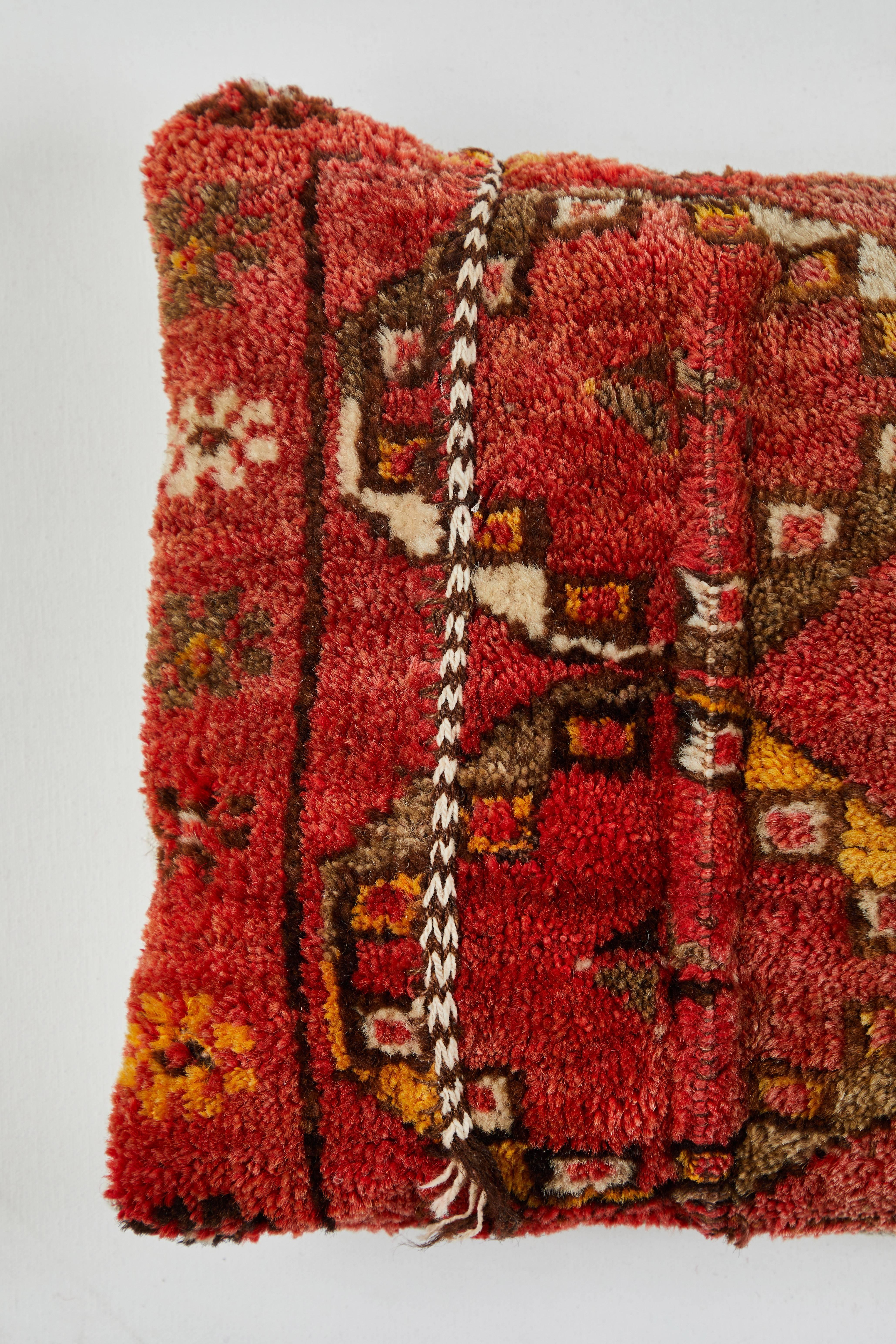 Vintage pile carpet pillow. Natural linen back. Feather and down fill. Zipper closure.
 