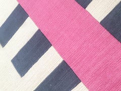 carpet pink and black lines through an earthen beige background, hand woven rug