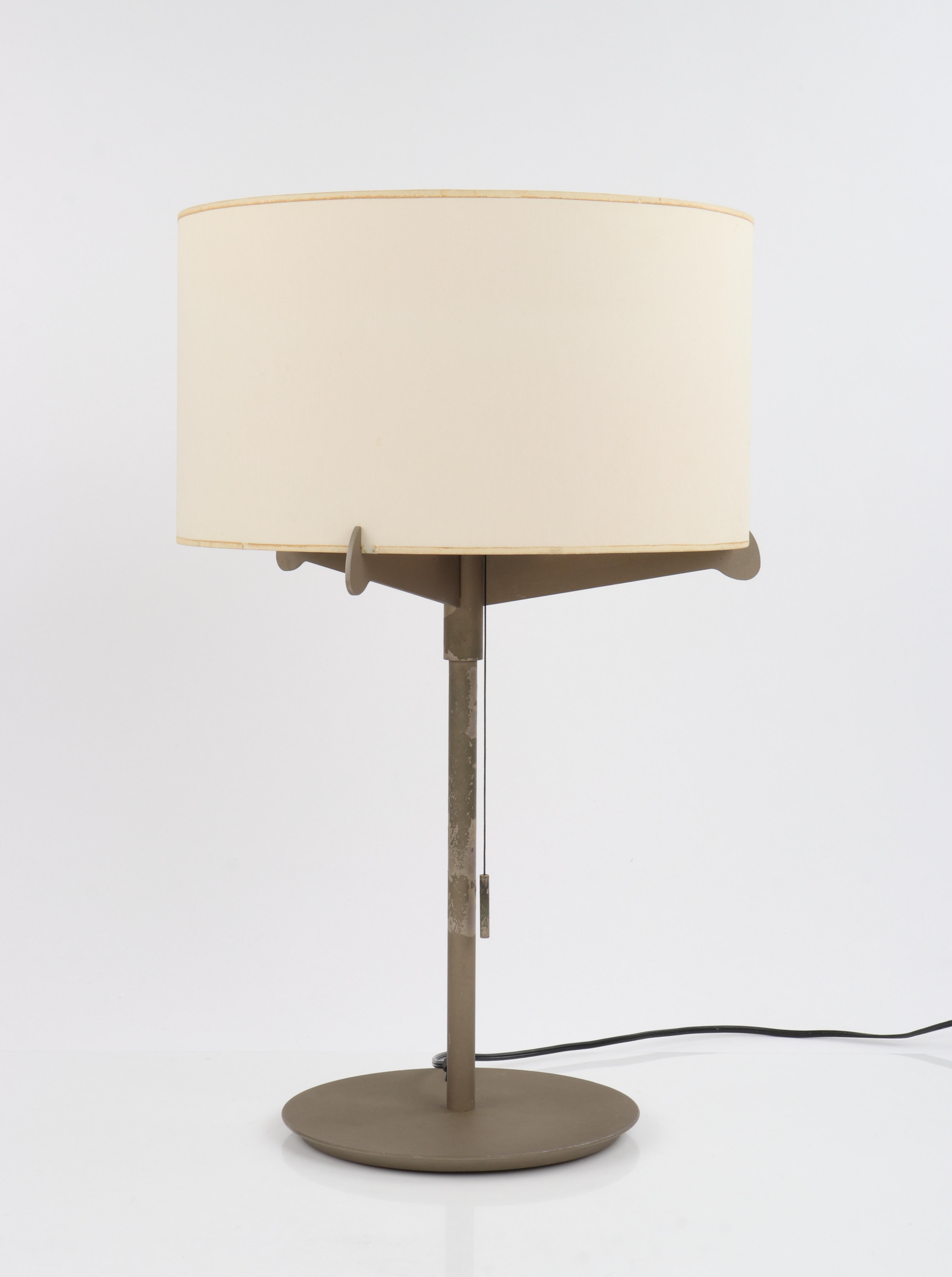 This sleek vintage table lamp combines an Industrial Mid-Century Modern aesthetic with contemporary Spanish style. Designed by Gabriel Teixido for Carpyen, circa 1974. Its tailored silhouette is crafted of a coated metal that begins with a raised