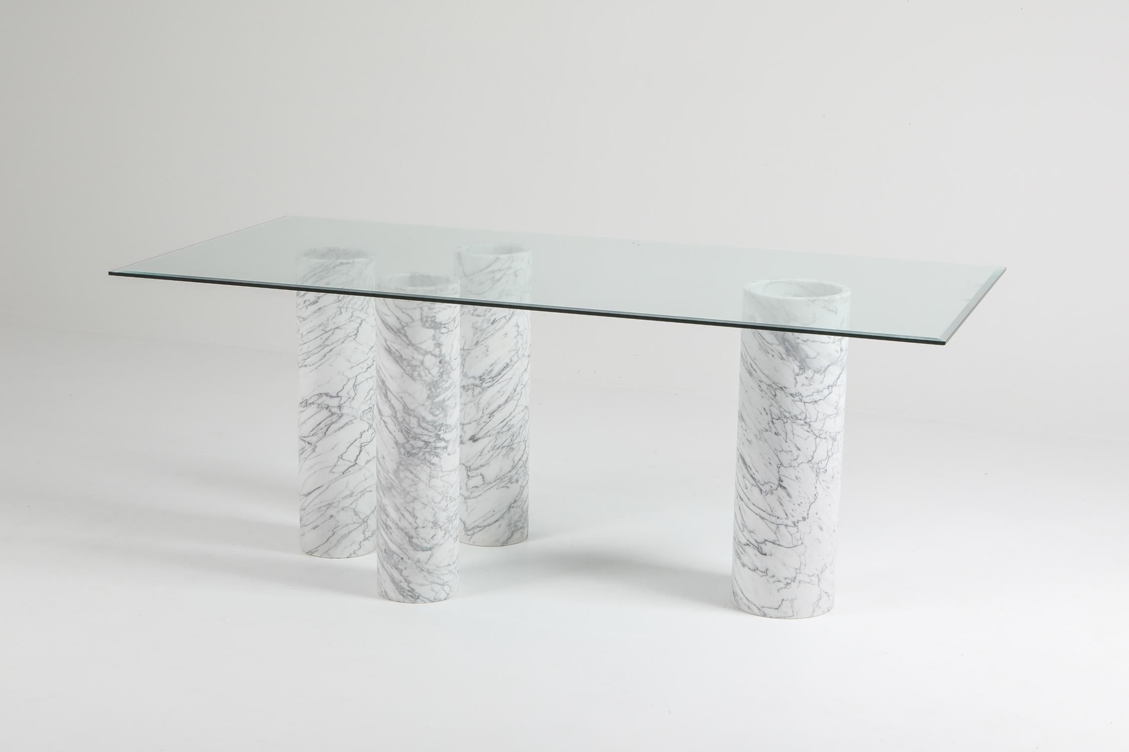 Postmodern dining table or writing desk consisting of four Carrara marble cylindrical bases.
One of these pillars has a wider diameter.
Minimalist piece
presented with ebonised chairs by Van den Berghe Pauvers.

       