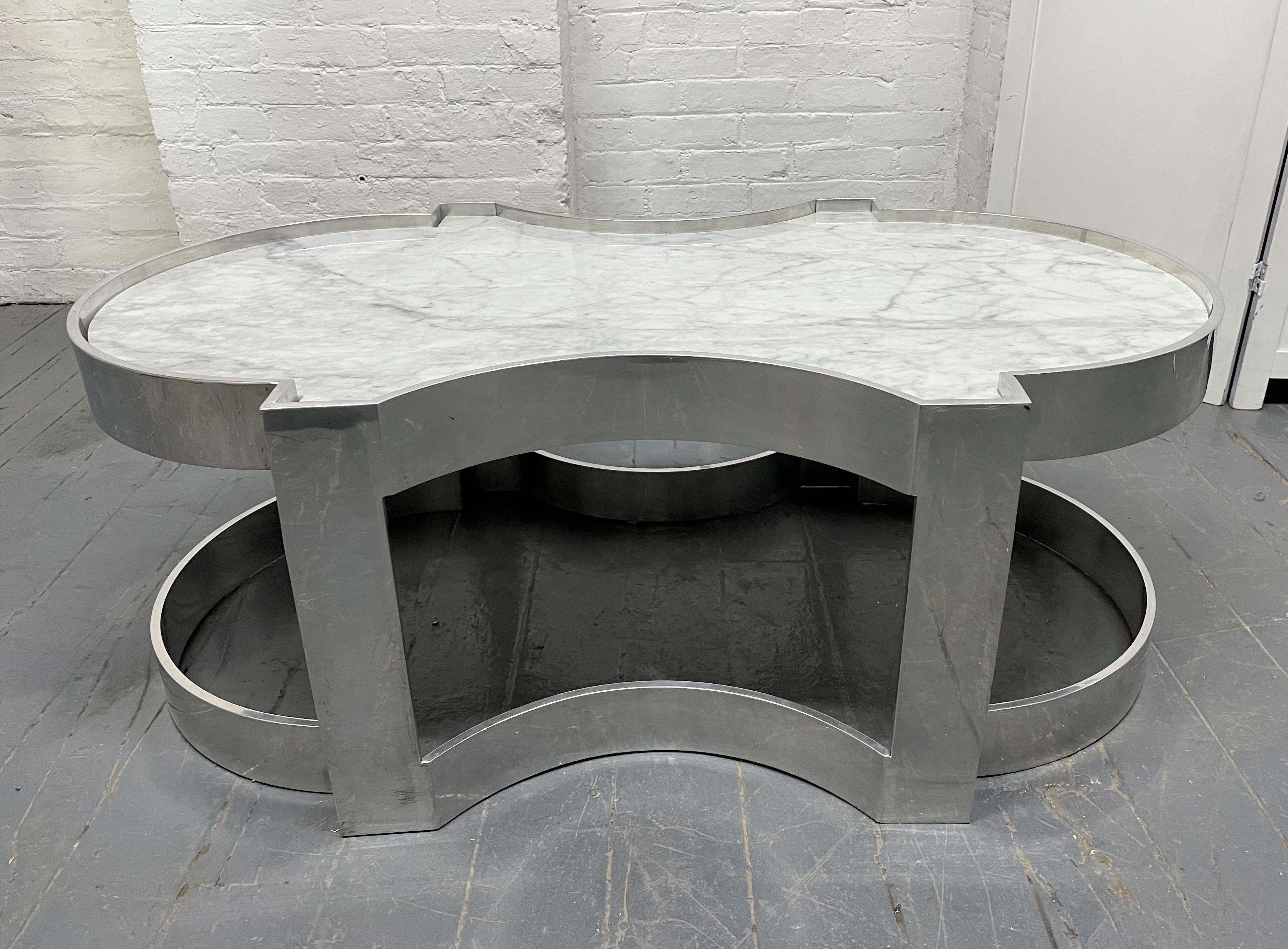 Carrara marble and chrome two-tier coffee table.