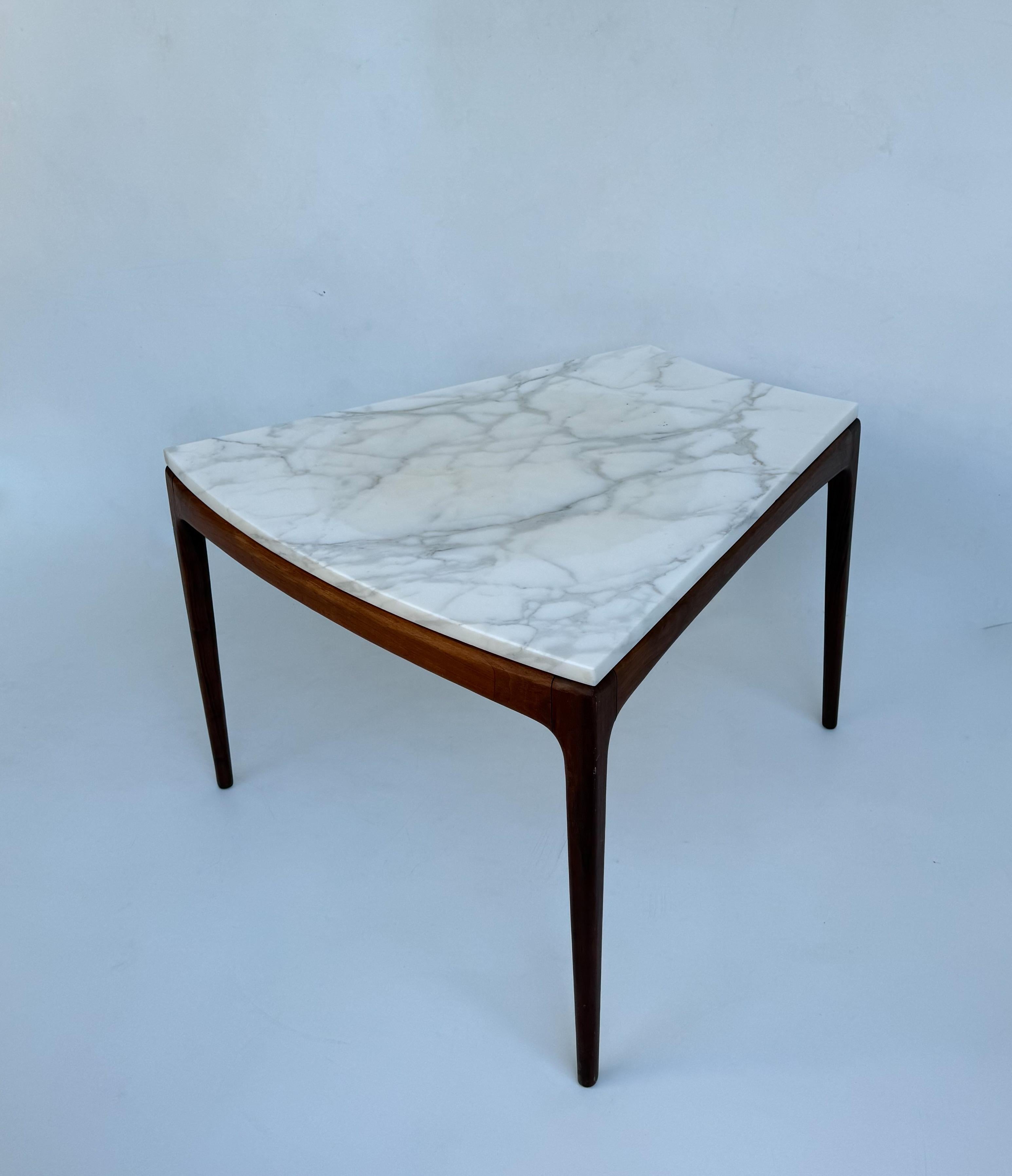 1960’s Dark Walnut wedge shape side table with an Italian Carrara marble top attributed to Lane Furniture.
The Marble top has been newly professionally polished, the walnut frame is in original condition, so shows minor wear consistent with