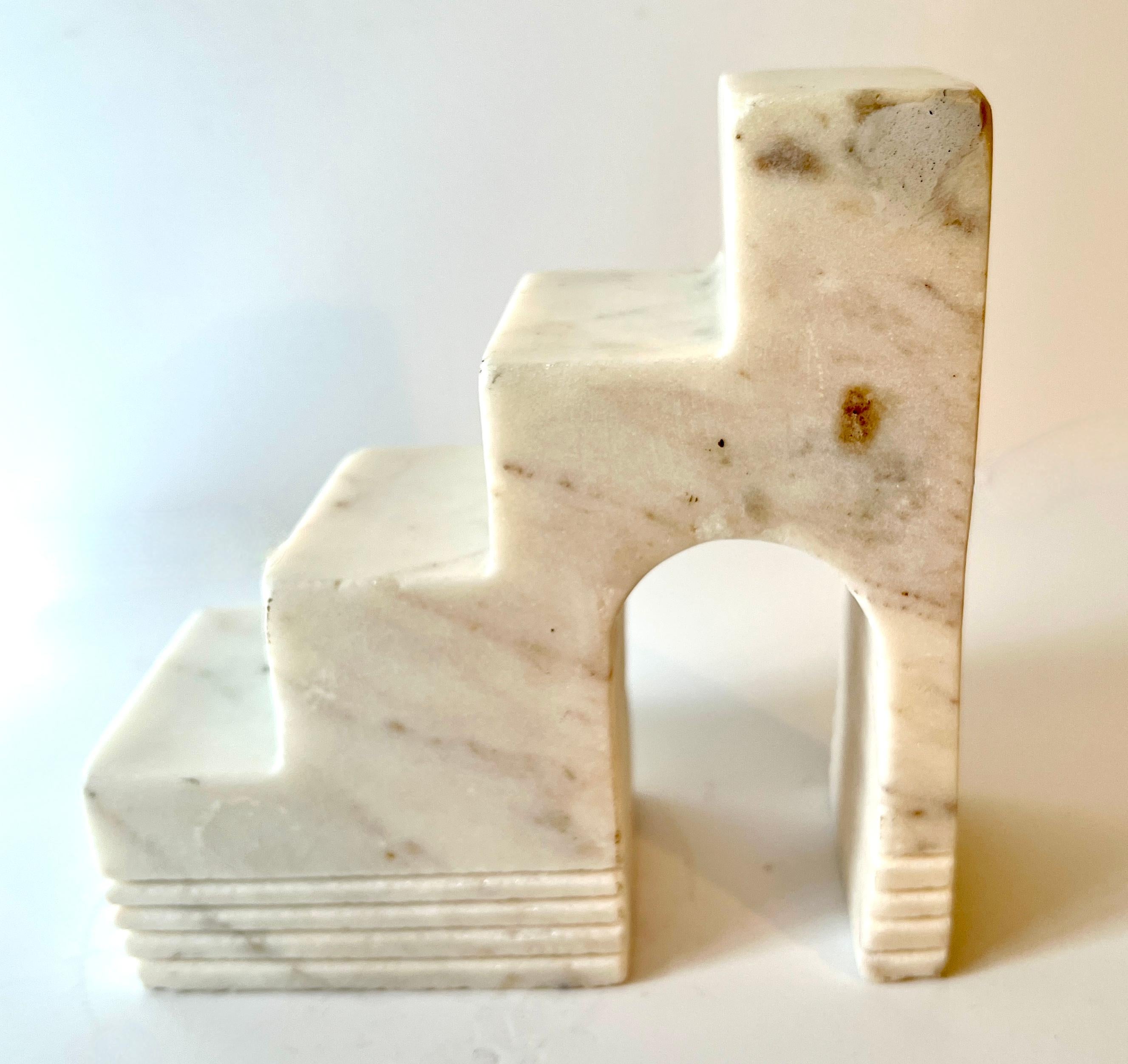 A Unique Italian Marble Sculpture that can stand alone as a piece of art - perfect for any shelf, cocktail table, guest room, also perhaps the kitchen.  The piece is a companion to another one of our sculptures and we have paired them as bookends.