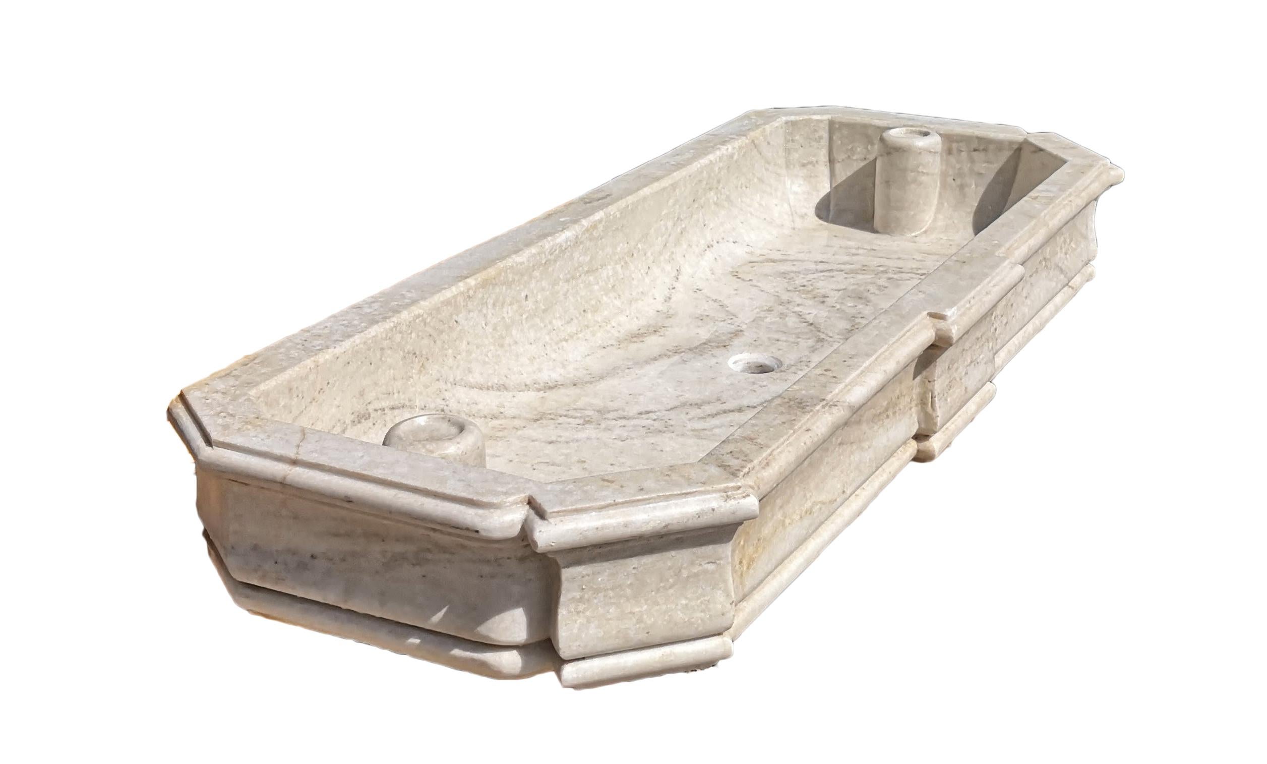 This timeless beautiful Italian classical double sink is cut from one single block of white Carrara marble, the design has not changed since Greek and Roman times, it carries superb artistic merit easily fitting in with old and new buildings. It
