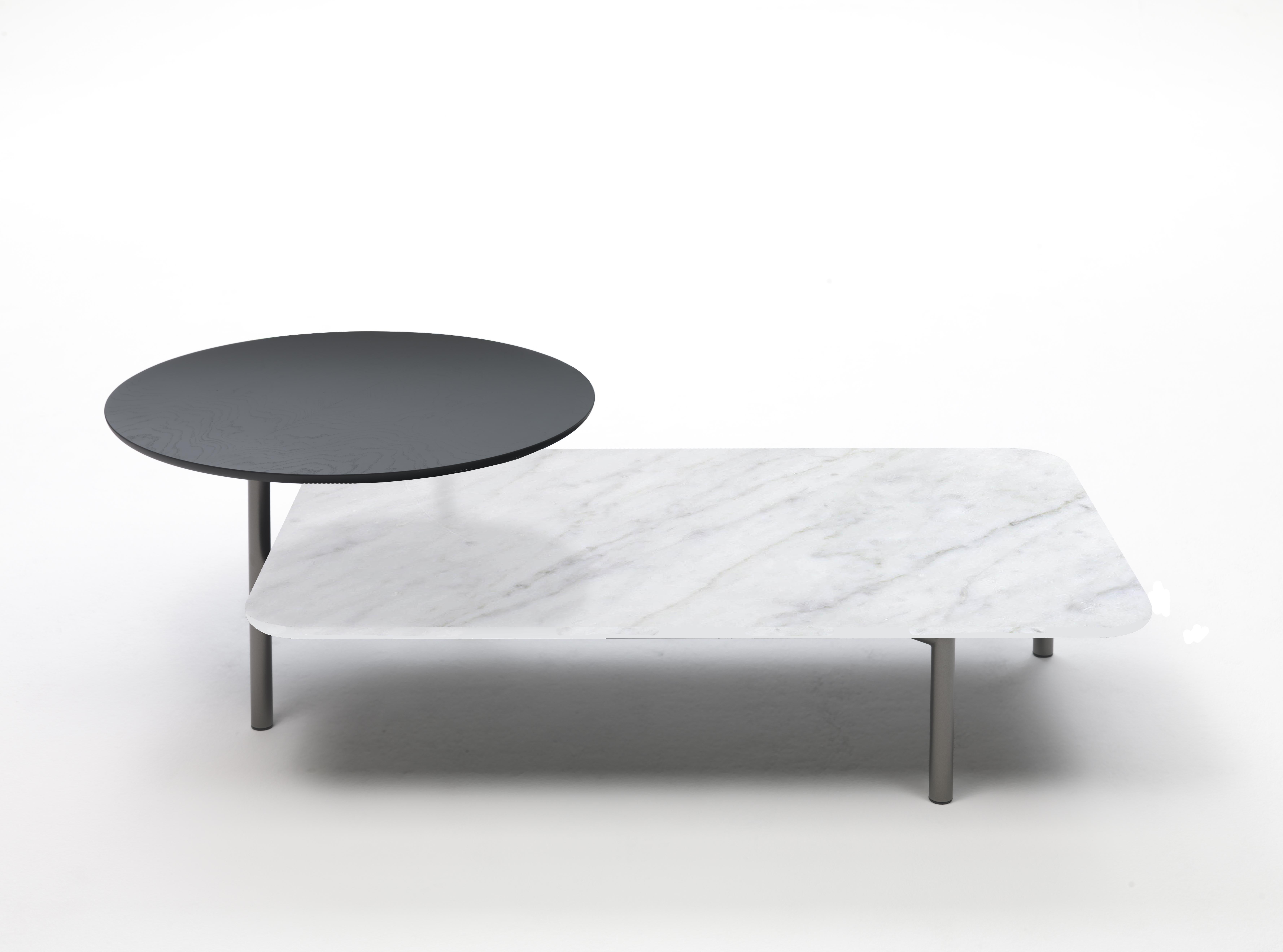 Carrara marble bitop coffee table by Rodolfo Dordoni
Materials: Base in bronze lacquered metal. 2 versions of tops: black Marquina marble, white Carrara marble, or gray smoked glass
Technique: Lacquered metal, polished marble. 
Dimensions: 140 x