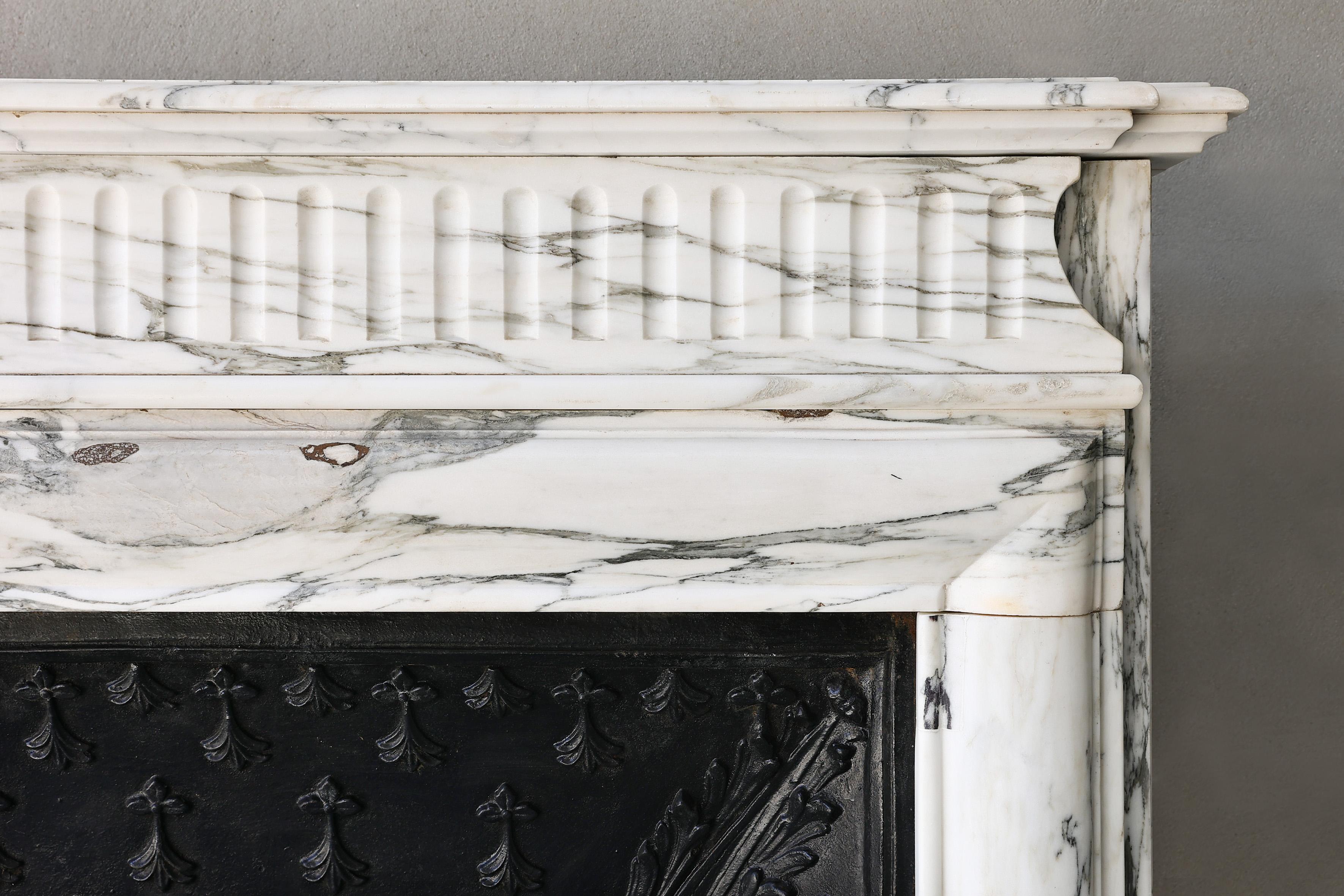 French Carrara marble fireplace from the 19th century in style of Louis XIV