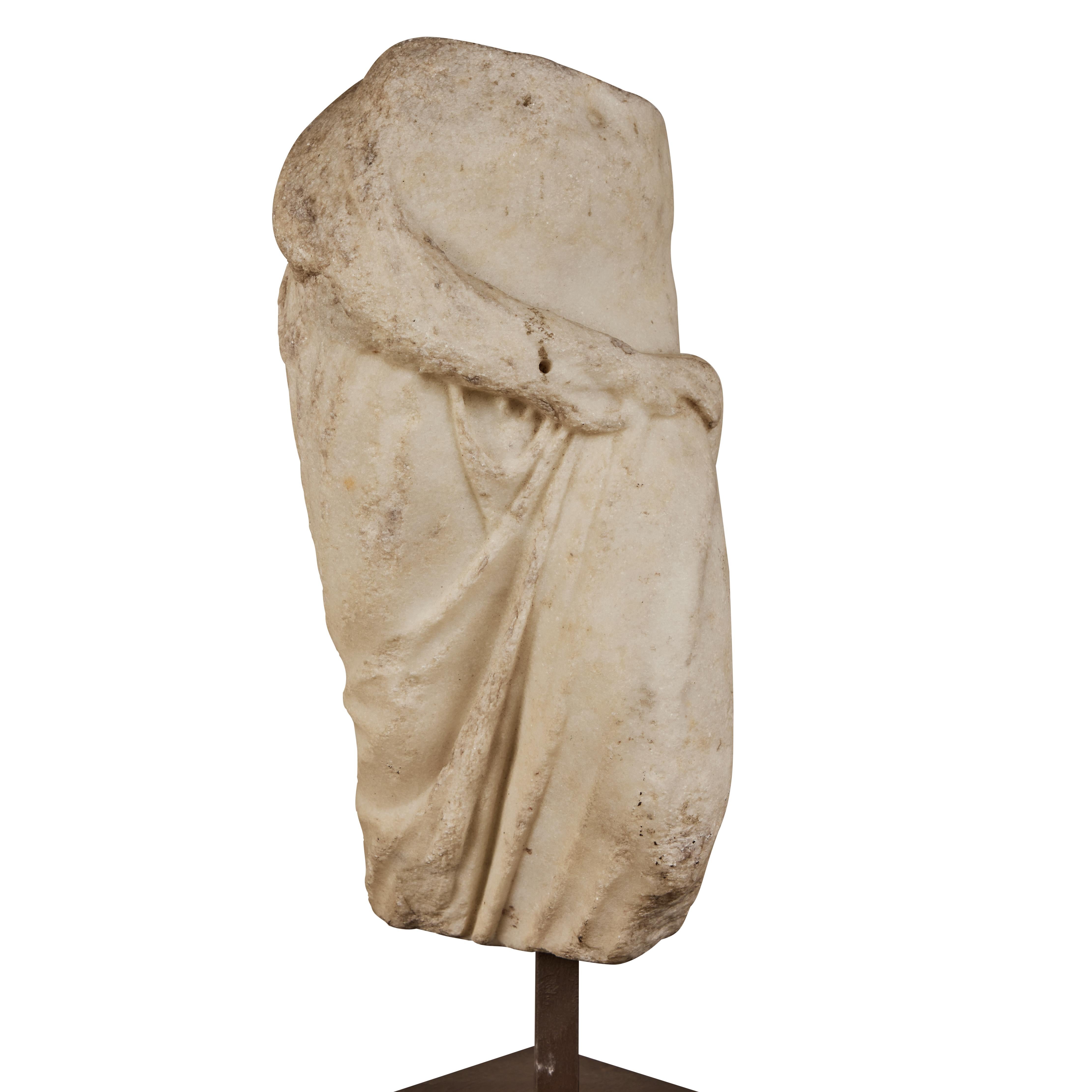 A graceful, Carrara marble fragment of the goddess Aphrodite mounted on a metal base. From the Piedmont Region of Italy. 
Roman Empire, 1st - 2nd century AD

Provenance: 