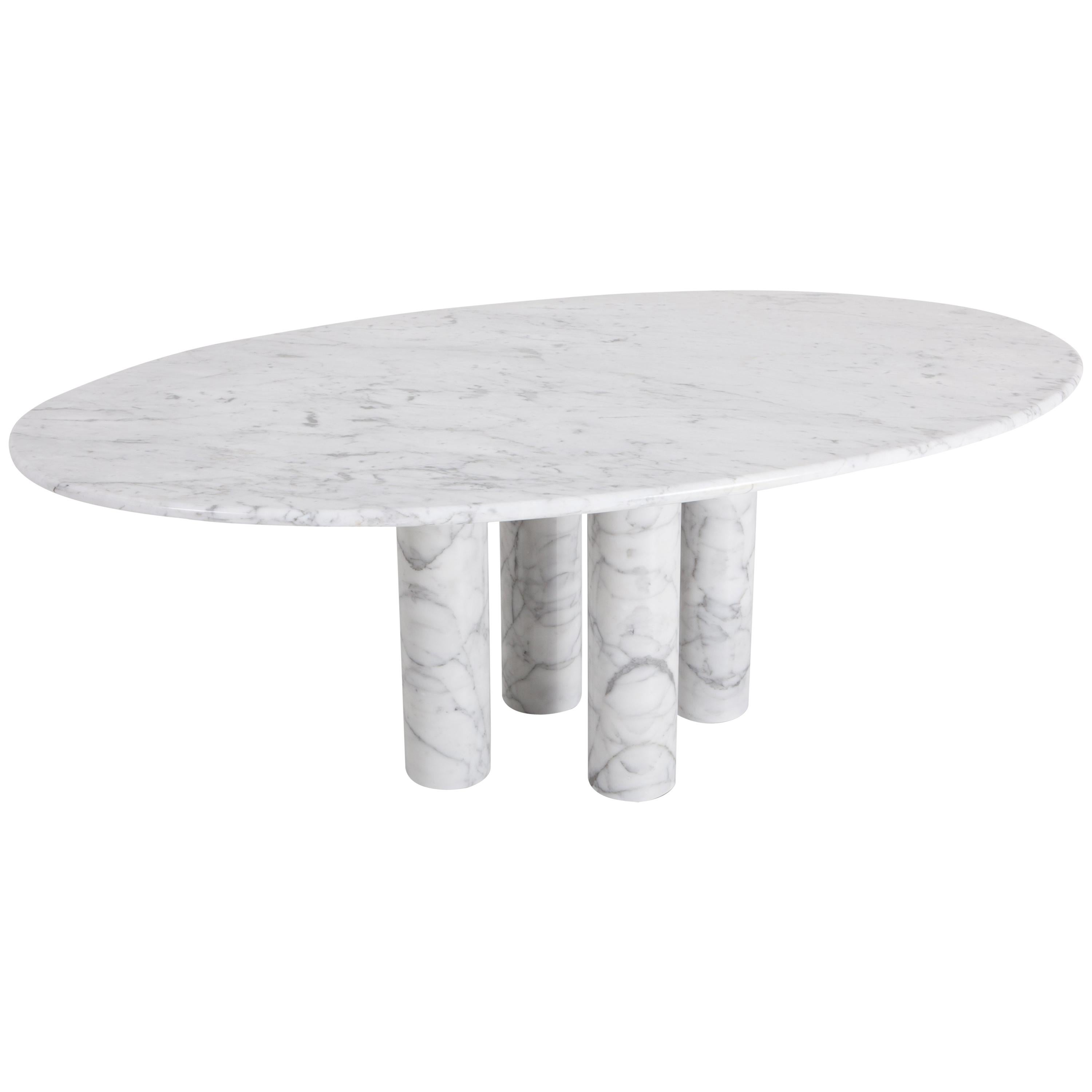 Cassina produced this Il Colonnata dining table by Mario Bellini in Italy 1977.
A forest of massive primordial columns. The sensuality of marble celebrates the material, evoking the mysterious solemnity of Stonehenge.

Mario Bellini (1935-) is