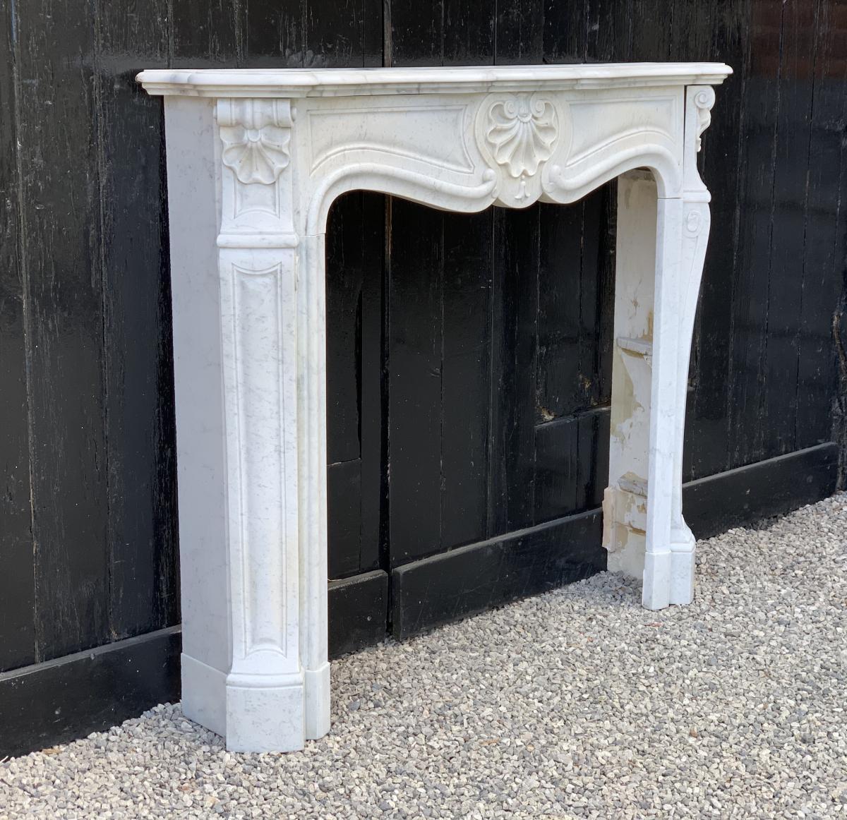 Carrara marble Louis XV style fireplace.