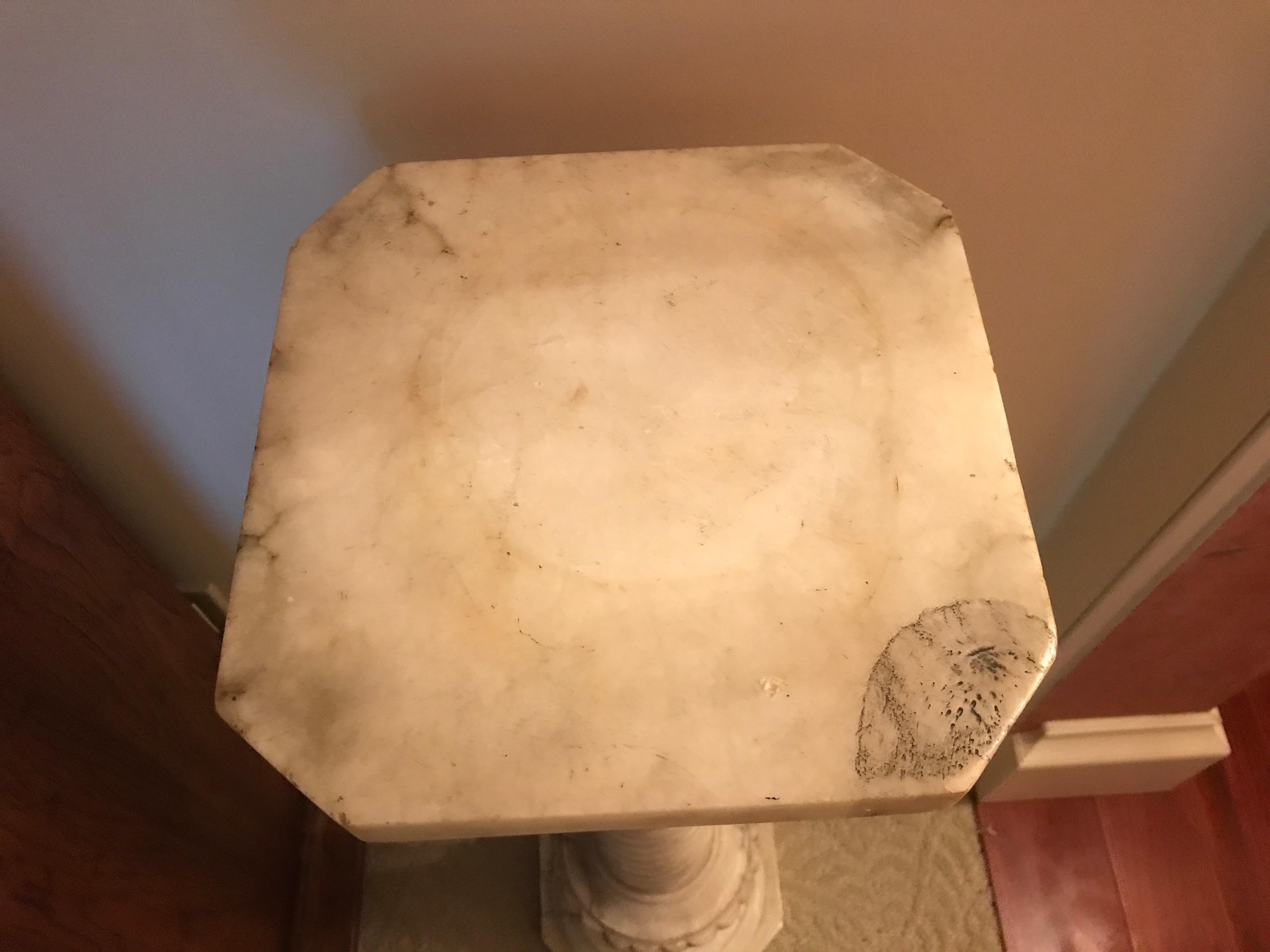 Carrara marble pedestal 

Detachable top 
35” high 
Top 10” x 10”
Bottom 10” x 10”.