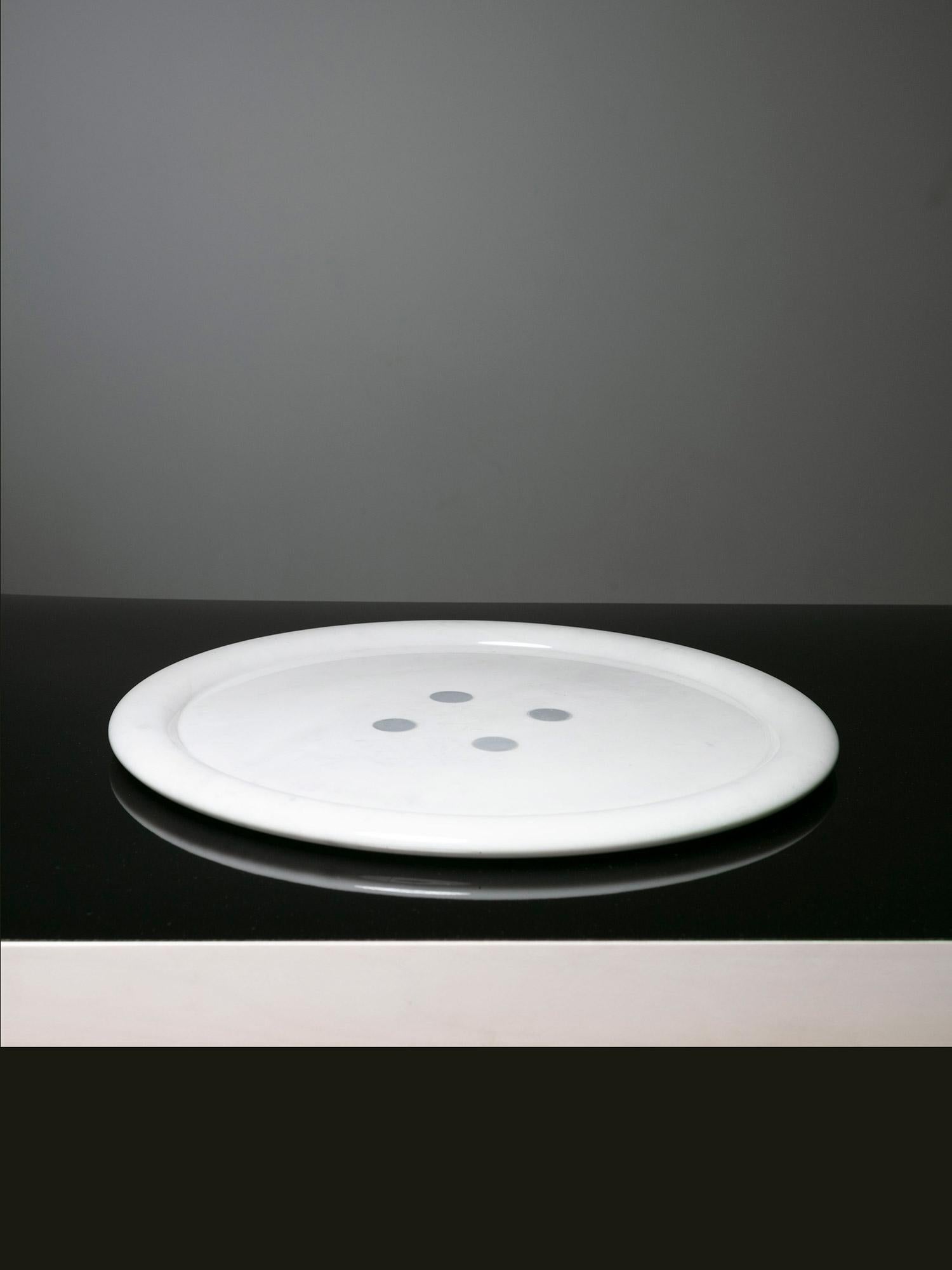 Marble centerpiece by Giulio Lazzotti for Casigliani.
A large button shaped white marble piece with gray spots.
