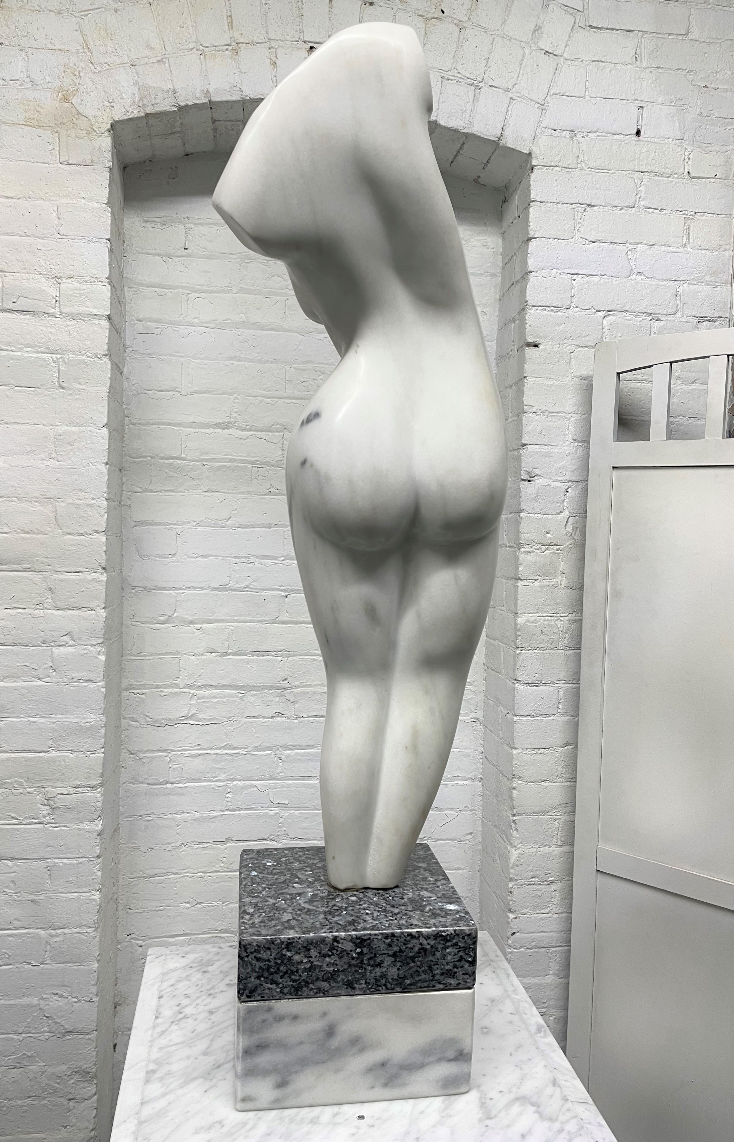 Tall, Italian Carrara marble female sculpture on pedestal. Date and signed on the back of the sculpture. The sculpture also swivels. The bottom base of the sculpture where it swivels is granite.