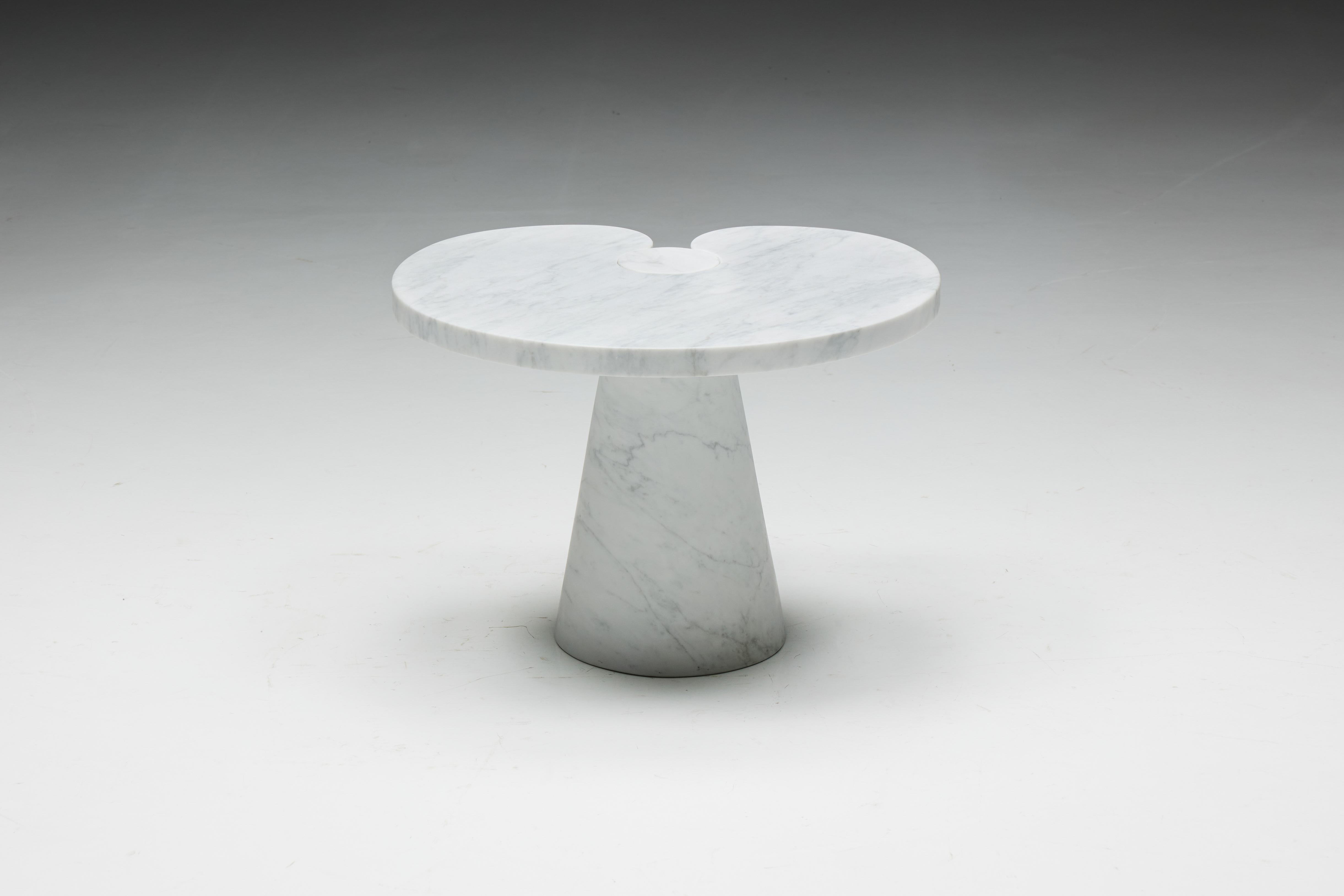 Carrara marble side Table by Angelo Mangiarotti, a masterful creation from the Eros series crafted for Skipper in Italy in the 1970s. Made entirely of solid white Carrara marble, its elegant design showcases beautiful veining throughout.

Angelo