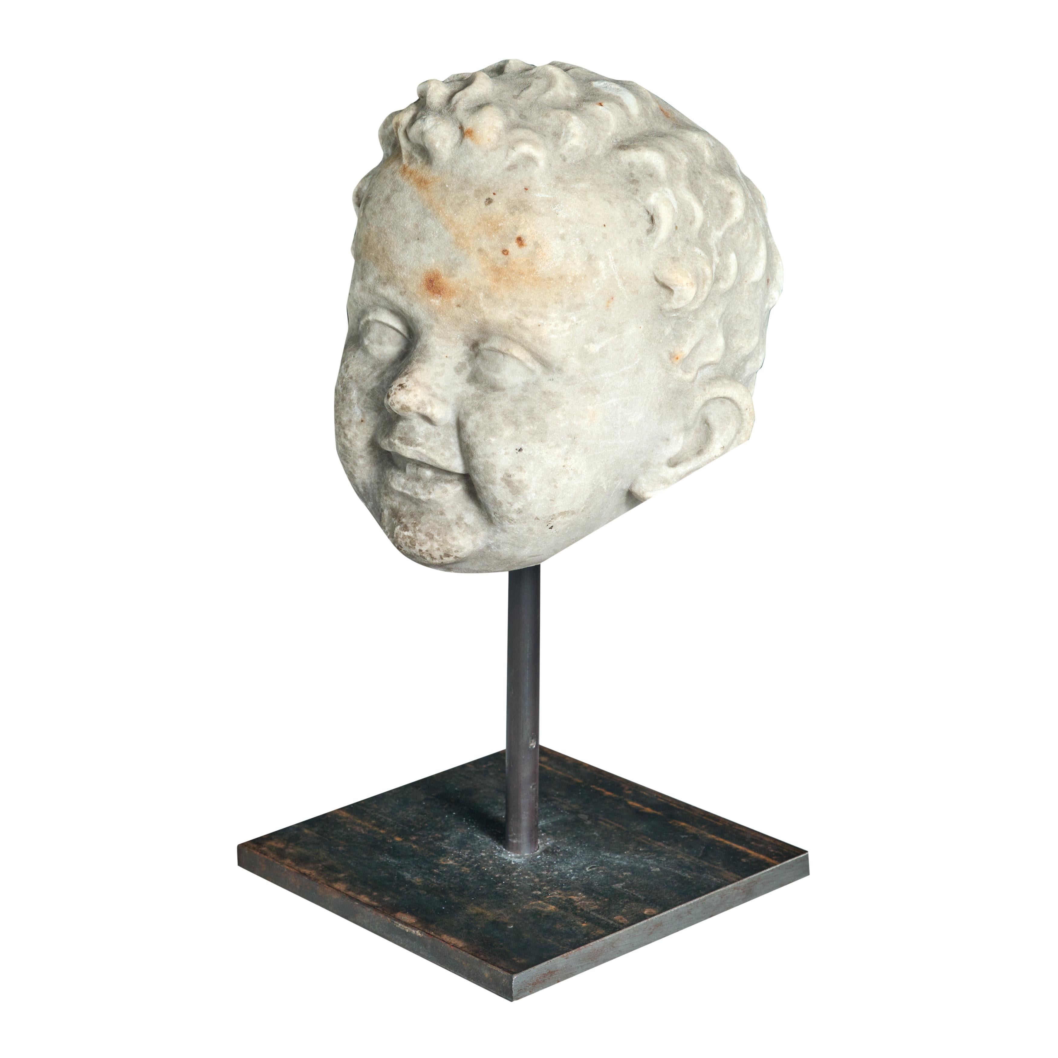 Carrara marble statue fragment of happy young man. Custom stand is newly made. 

Italy

Circa 1820

Marble. Metal stand. 

