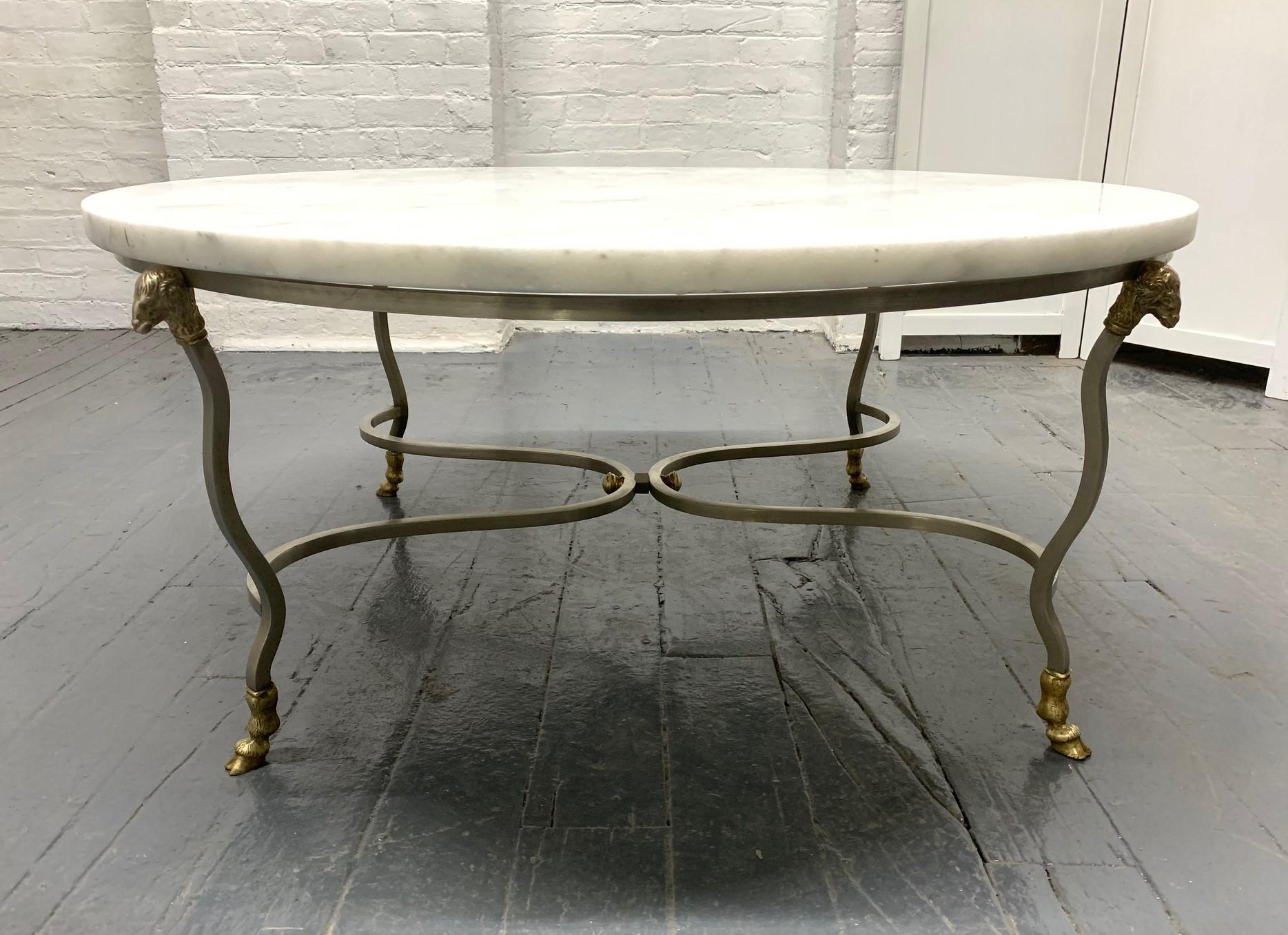 Carrara marble-top steel and brass coffee table with Ram's head. Marble is 1/2 inch thick. Maison Jansen style. 
 
