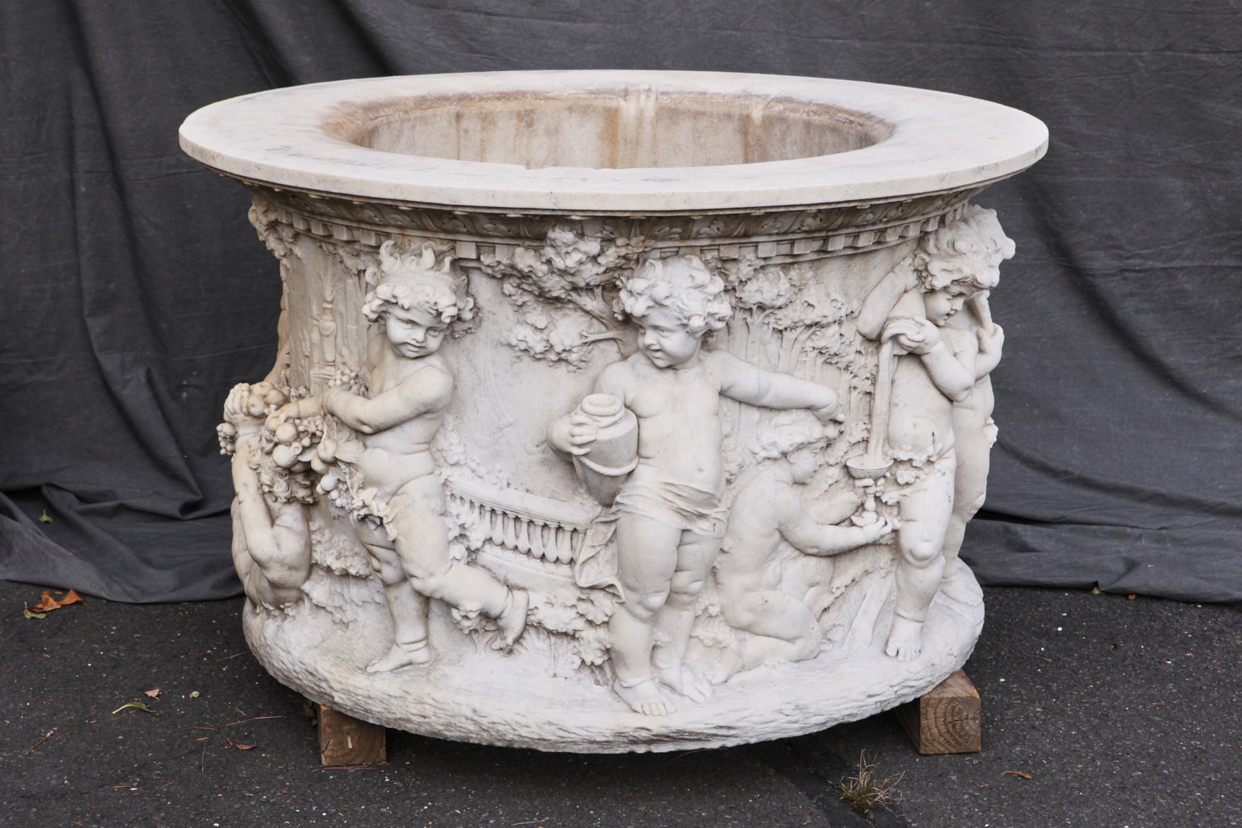 Classical Roman Carrara Marble Wellhead with Intricate Carvings Raised on Octagonal Base, 1920s