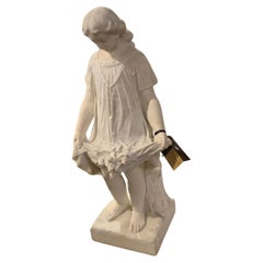 Carrara white marble sculpture of a young girl with flowers