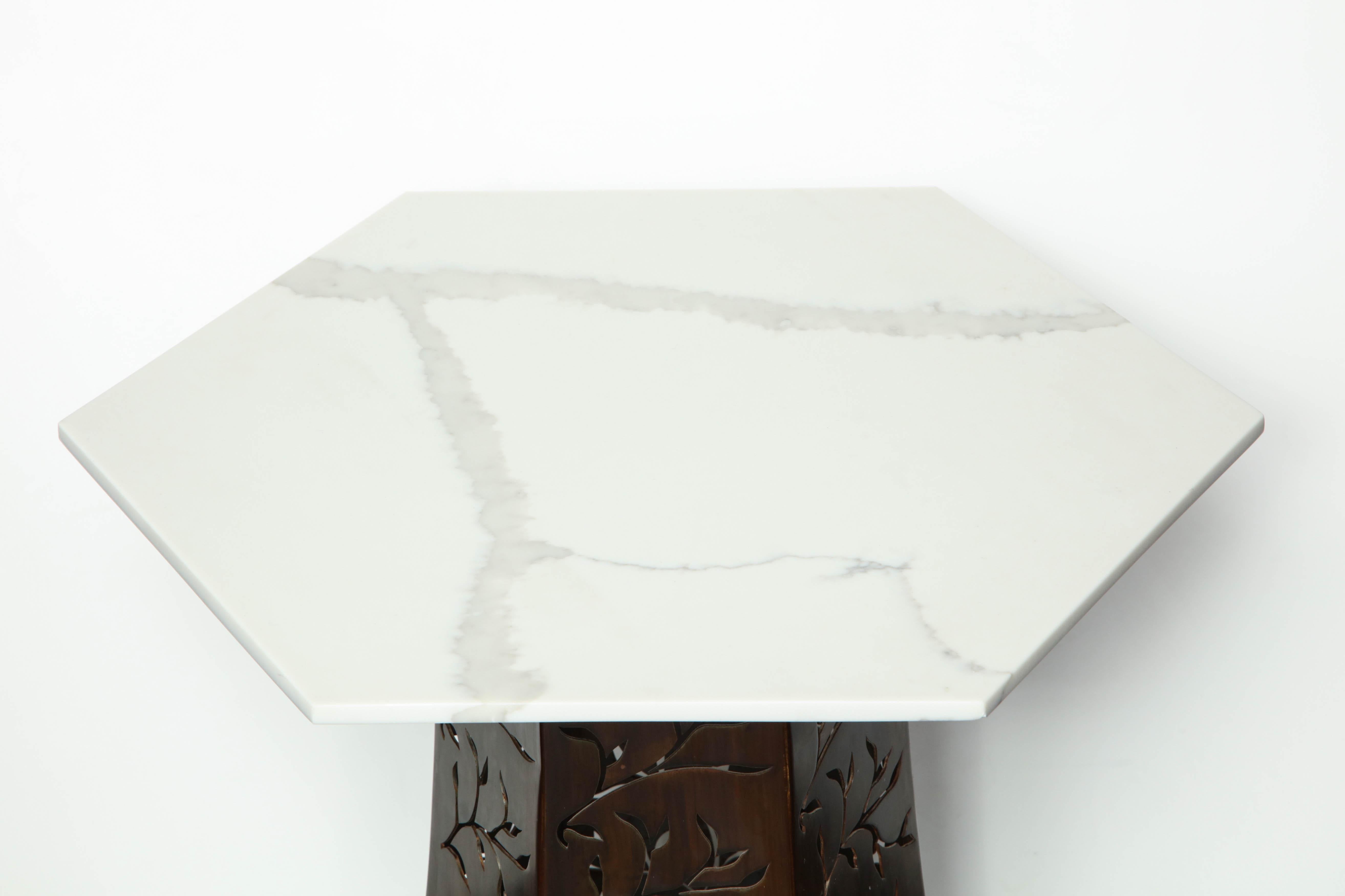 Carrara white marble with patinated blackened steel.