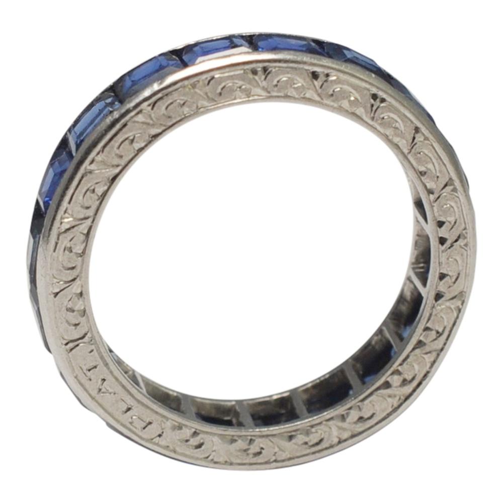 Carré cut sapphire and platinum eternity ring; this is a superb example of an original 1930s eternity ring set with sapphires totalling 3cts (approximately).  The carré cut stones are a strong shade of blue in a channel setting.  The upper and