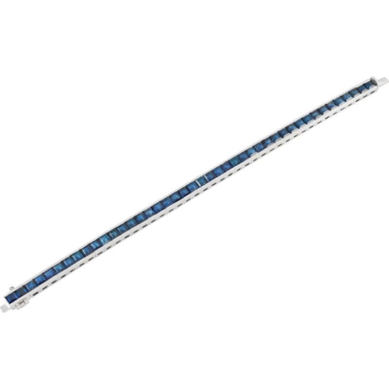 Carre cut Sapphire tennis bracelet set in platinum. Sapphire total weight: 18.80 carats. Length 7.5 inches.