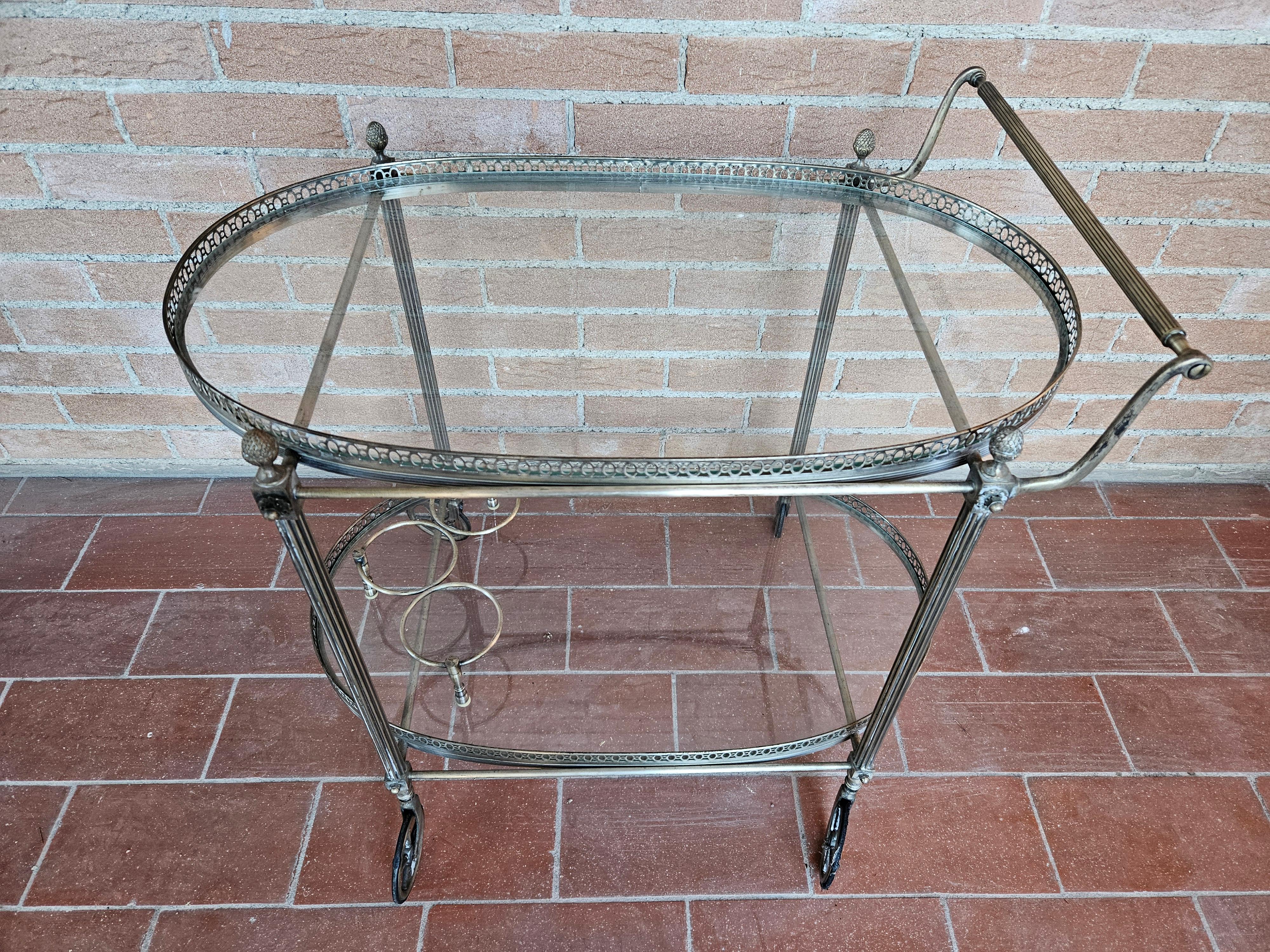 Regency 1970s hall bar cart made of machined brass and glass For Sale