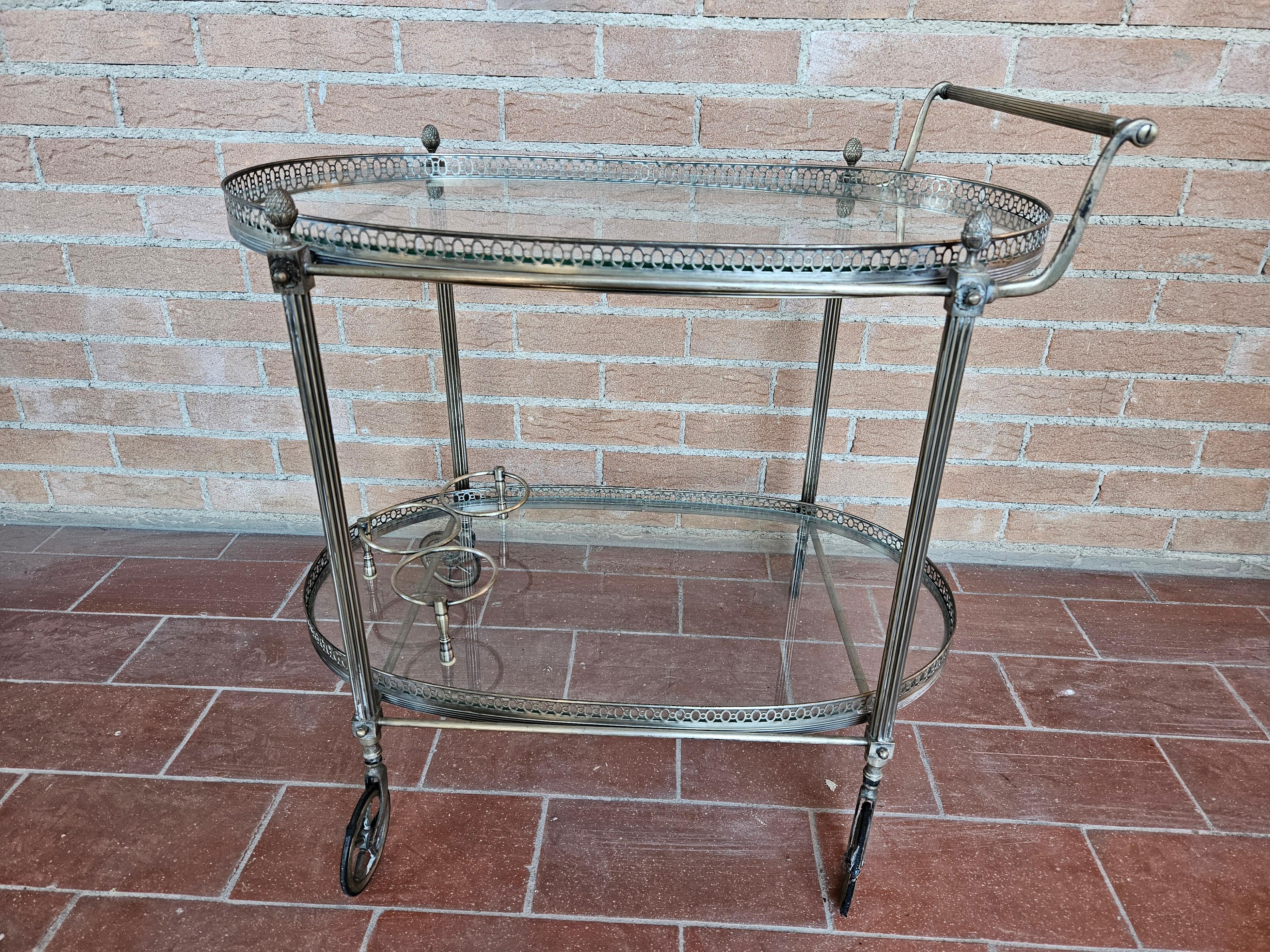 Italian 1970s hall bar cart made of machined brass and glass For Sale